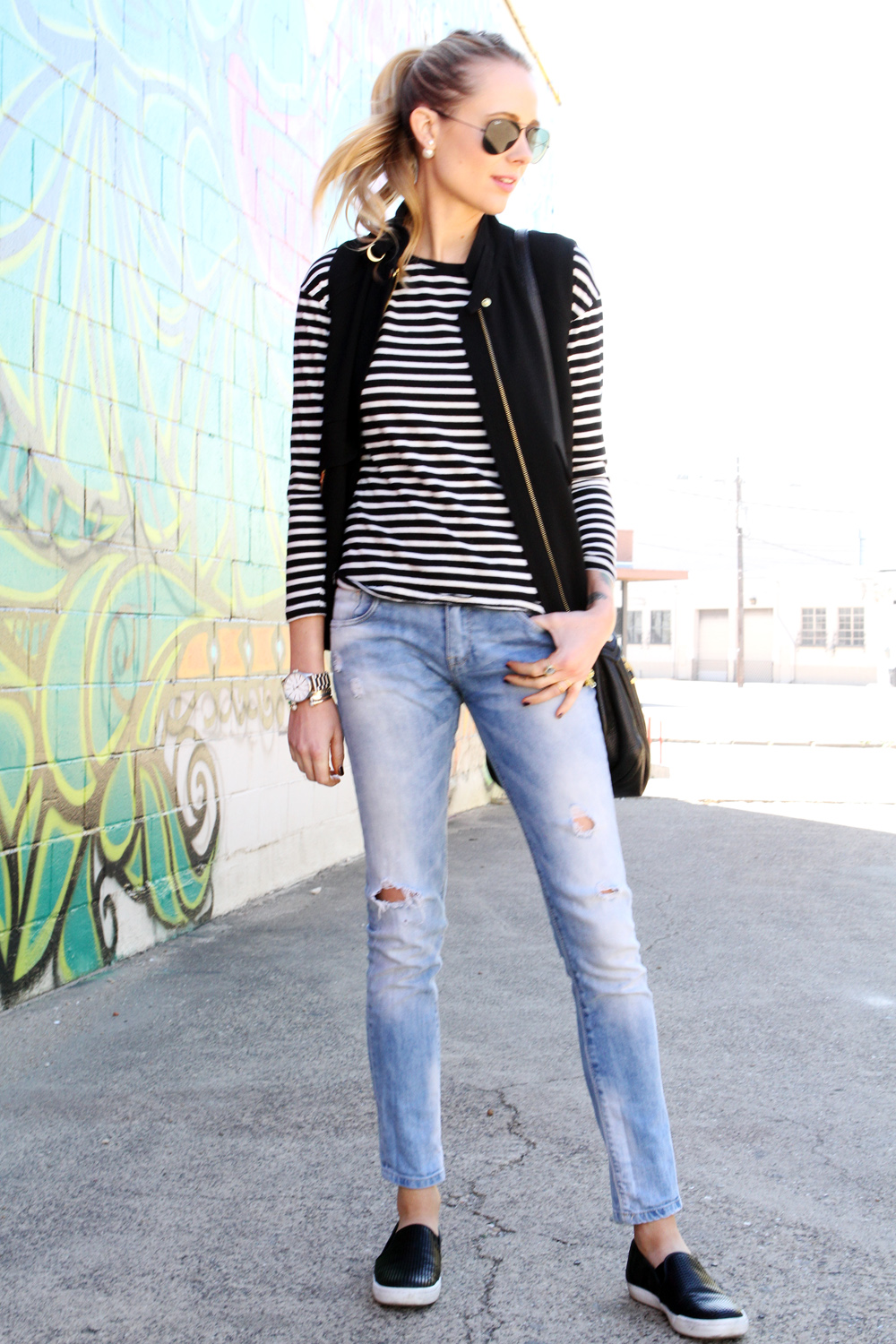 elycia black vest, black & white stripe shirt, ripped denim jeans, black sneakers