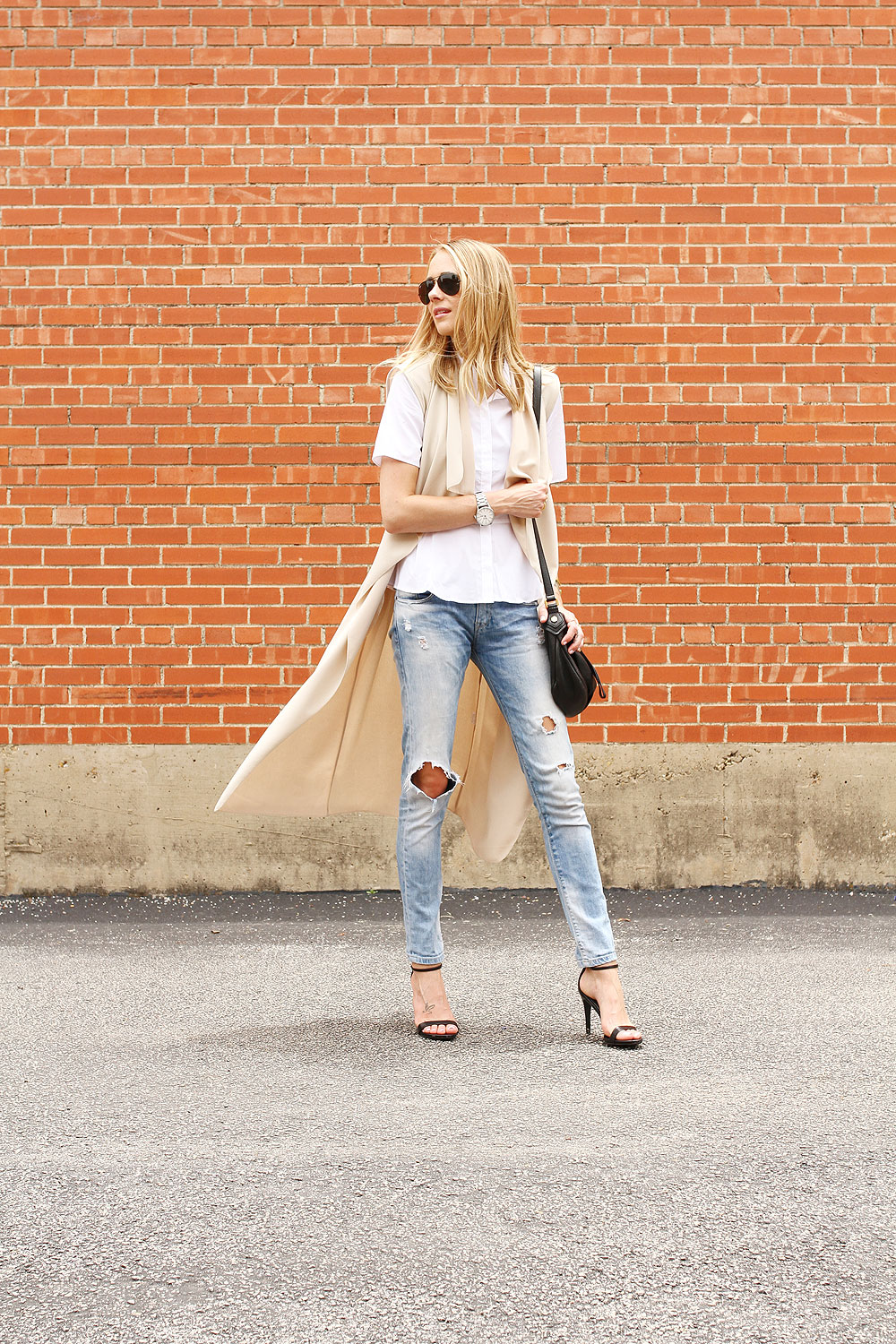 sleeveless trench-white button up shirt-ripped denim jeans-black heeled sandals