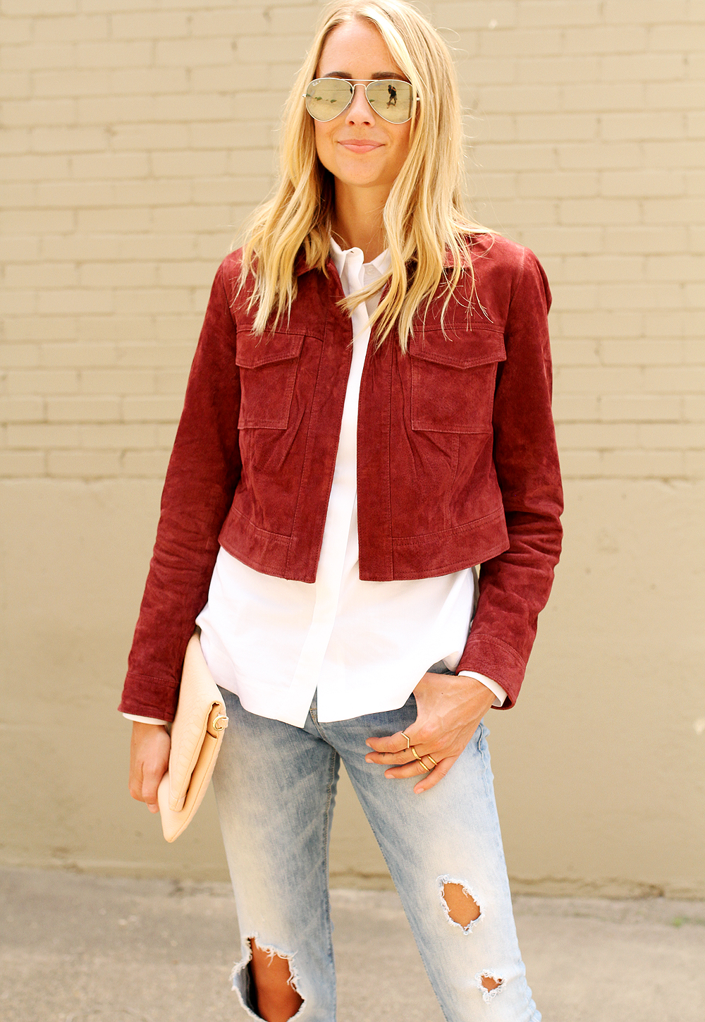 fashion-jackson-burgundy-suede-jacket-white-button-up-shirt-ripped-skinny-jeans-gigi-new-york-blush-carly-clutch-nude-pumps-ray-ban-silver-mirror-aviator-sunglasses