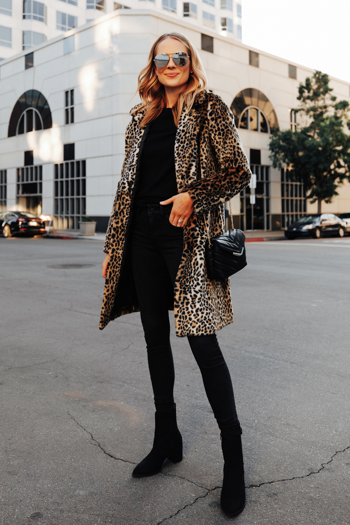 Fashion Jackson Wearing Express Faux Fur Leopard Coat Black Sweater Black Jeans Black Booties 1