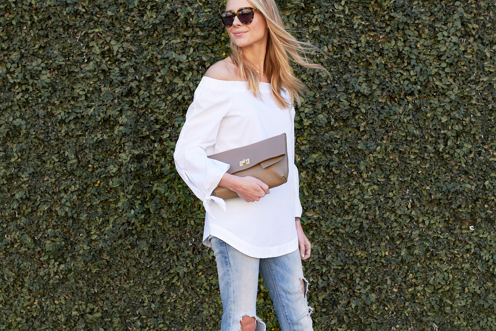 fashion-jackson-gigi-new-york-claire-clutch-taupe-free-people-white-off-the-shoulder-top-denim-ripped-jeans-tortoise-sunglasses
