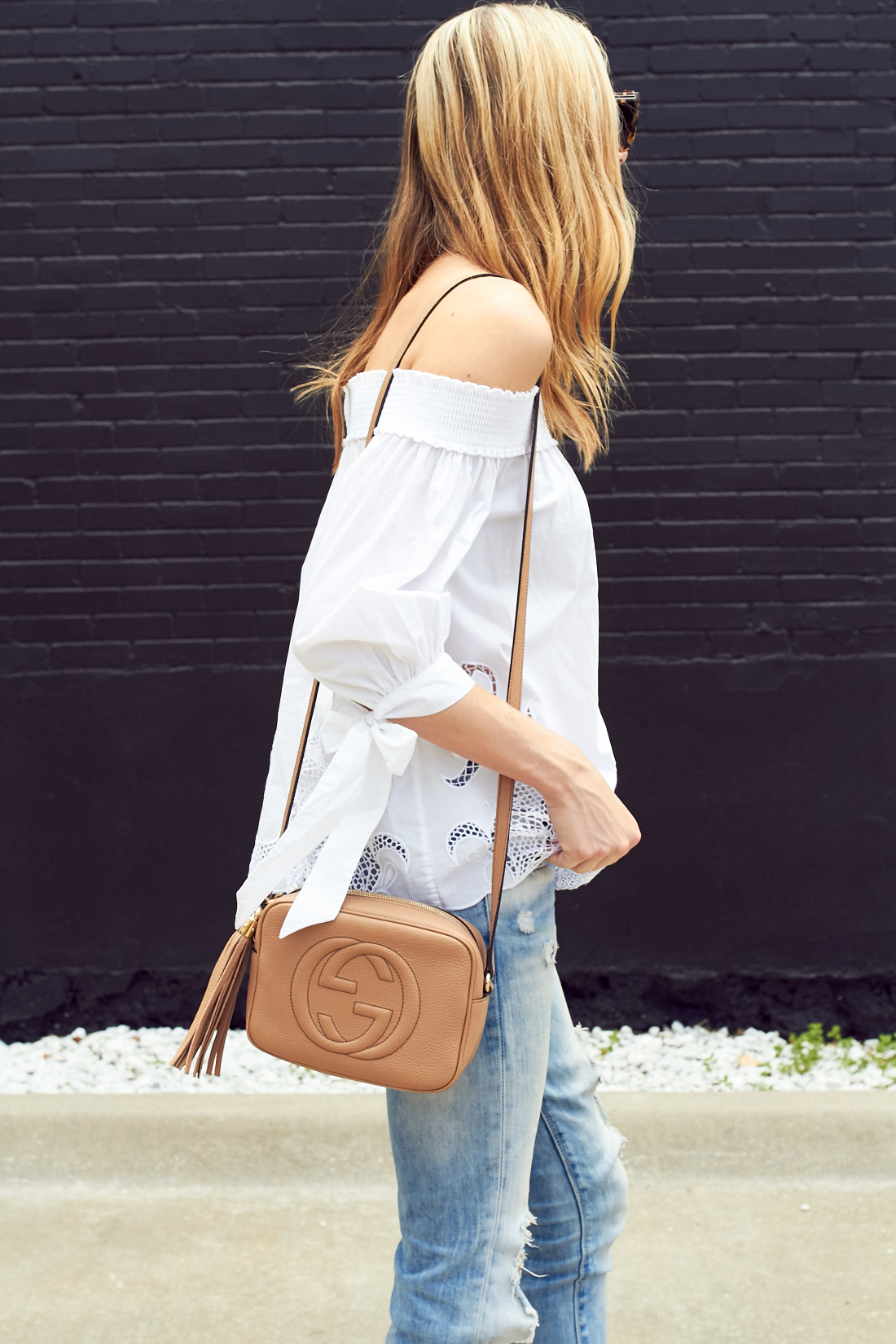 fashion-jackson-white-off-the-shoulder-cutout-top-denim-ripped-jeans-gucci-soho-disco-handbag