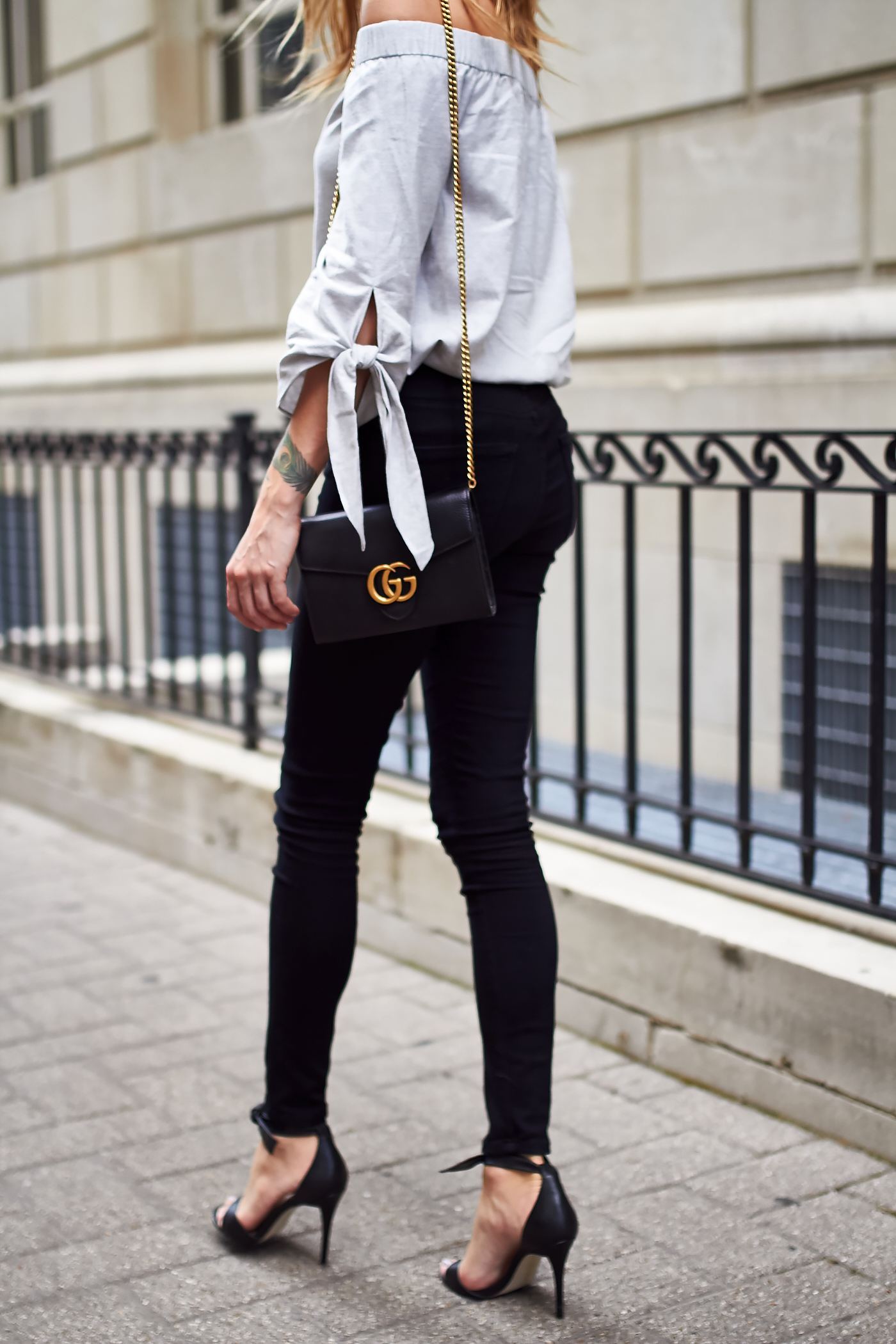 fashion-jackson-black-skinny-jeans-gucci-marmont-handbag-grey-off-the-shoulder-top-black-heels