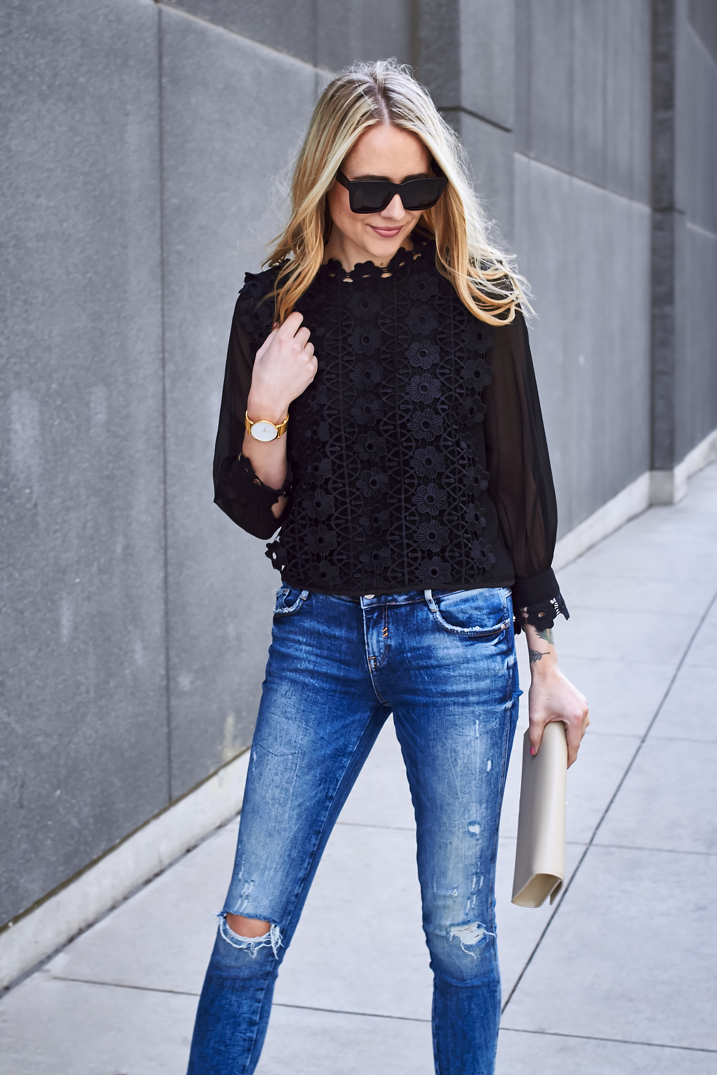 blue jeans black top outfit