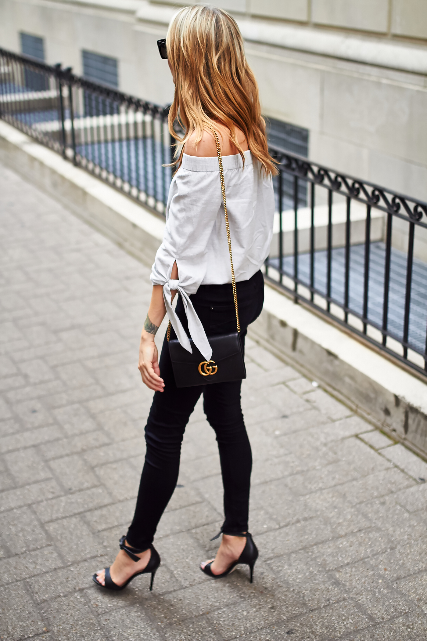 fashion-jackson-grey-off-the-shoulder-top-black-skinny-jeans-gucci-marmont-handbag-black-heels