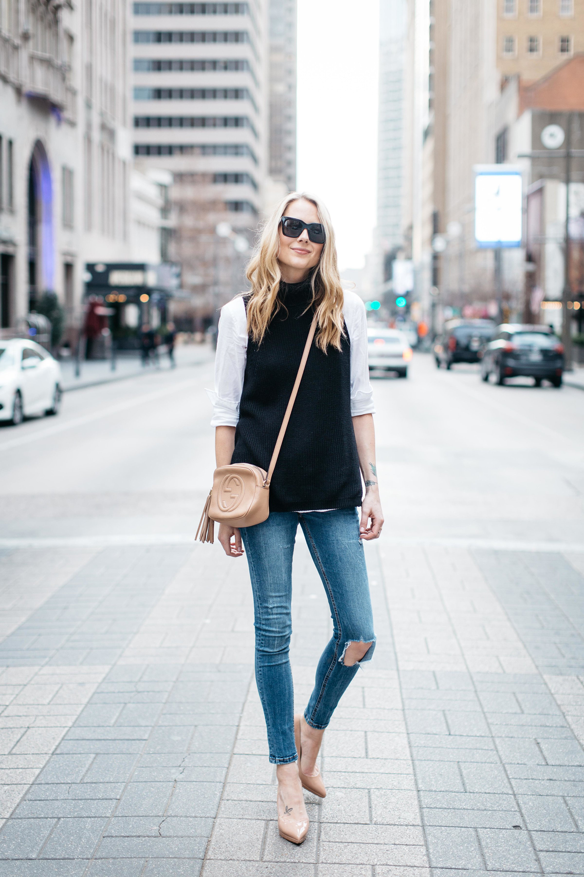 Fall Outfit, Winter Outfit, White Button Down Shirt, Black Sleeveless Turtleneck Sweater, Denim Ripped Skinny Jeans, Gucci Soho Handbag, Nude Pumps