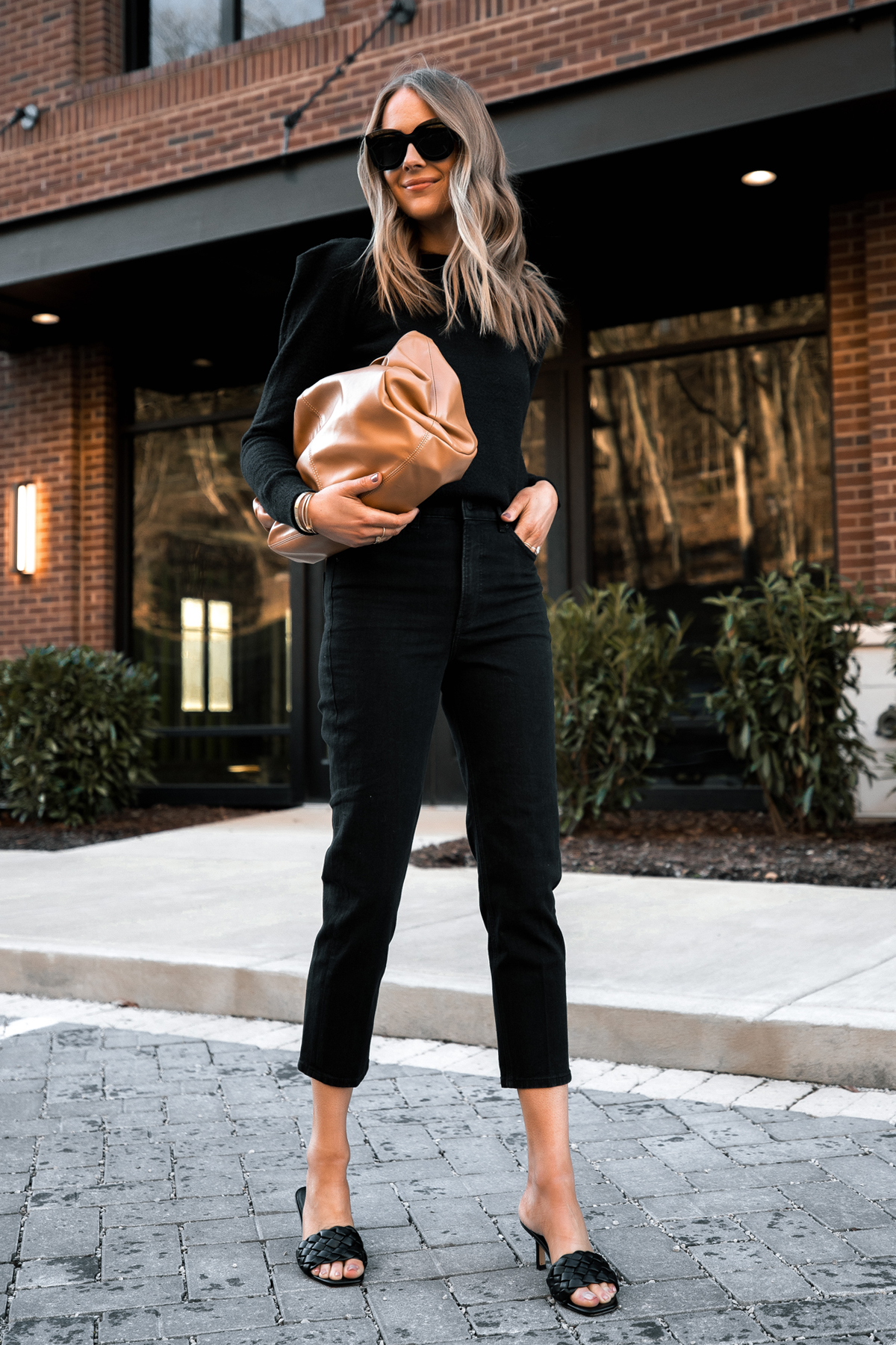 https://fashionjackson.com/wp-content/uploads/2017/02/Fashion-Jackson-Wearing-Express-Black-Puff-Sleeve-Sweater-Black-Mom-Jeans-Black-Sandals-Tan-Handbag.jpg