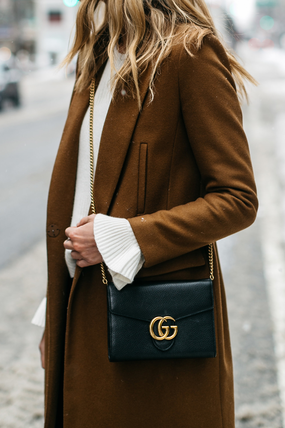 NYFW, Winter Outfit, Camel Wool Coat, White Ruffle Sleeve Sweater, Black Faux Leather Pants, Gucci Marmont Handbag, Street Style