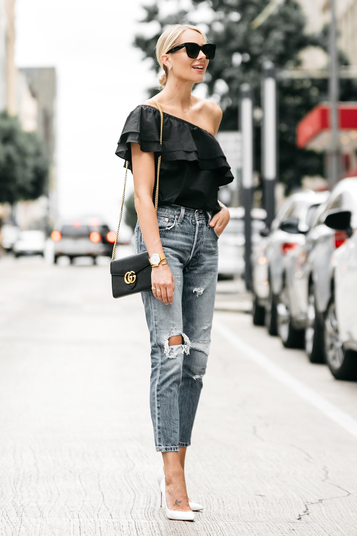 Houston top fashion and lifestyle blogger LuxMommy styles button up top, ripped  jeans, Louis Vuitton bumbag, and vans sneakers