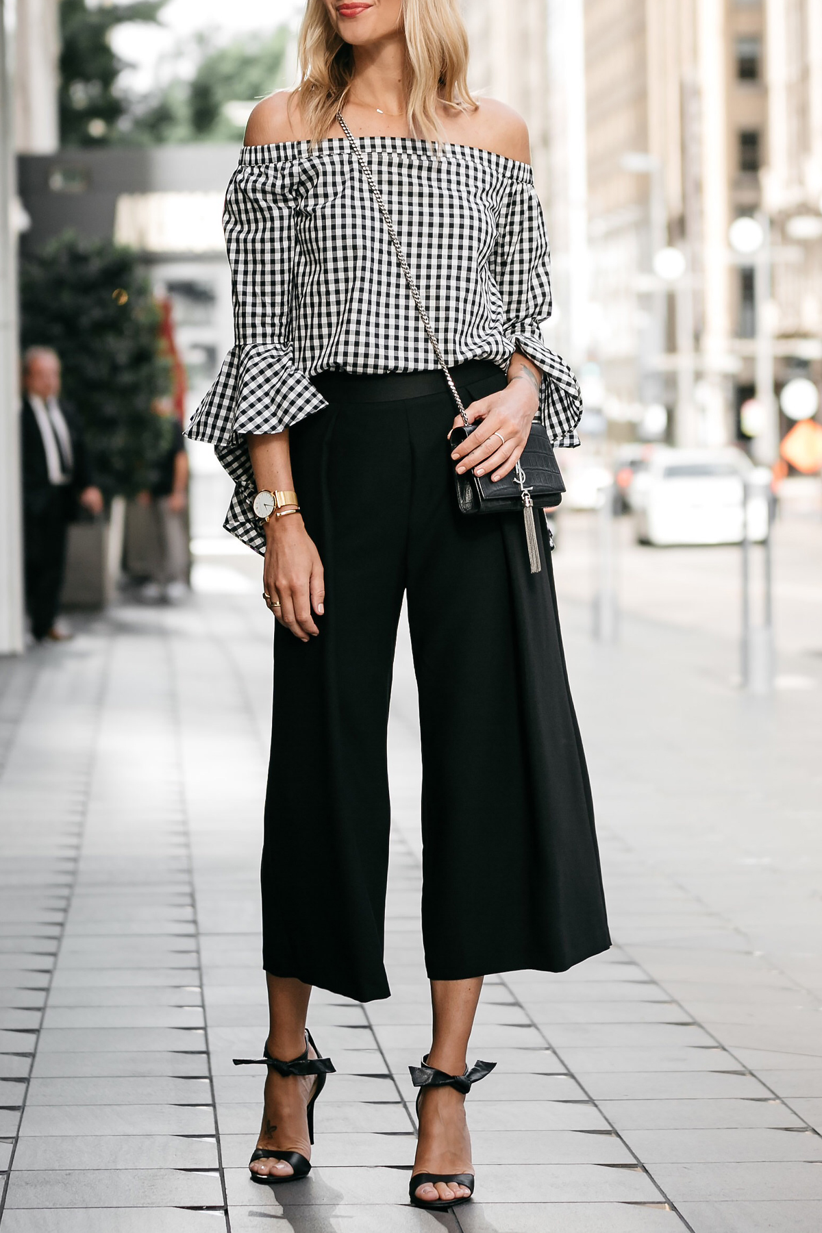 Blonde woman wearing nordstrom gingham off-the-shoulder top topshop black culottes outfit black bow heels ysl crossbody street style dallas blogger fashion blogger