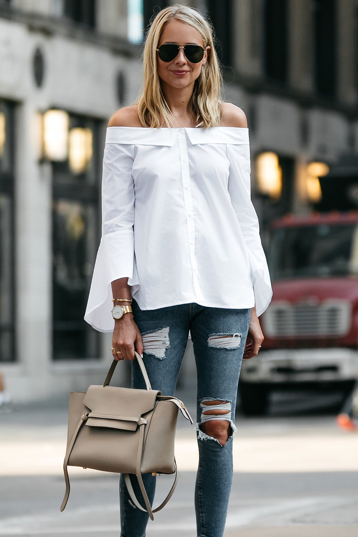 Blonde Woman Wearing Nordstrom Anniversary Sale White Bell-Sleeve off-the-shoulder Top Topshop Denim Ripped Skinny Jeans Outfit Celine Belt Bag Celine Aviator Sunglasses Fashion Jackson Dallas Blogger Fashion Blogger Street Style