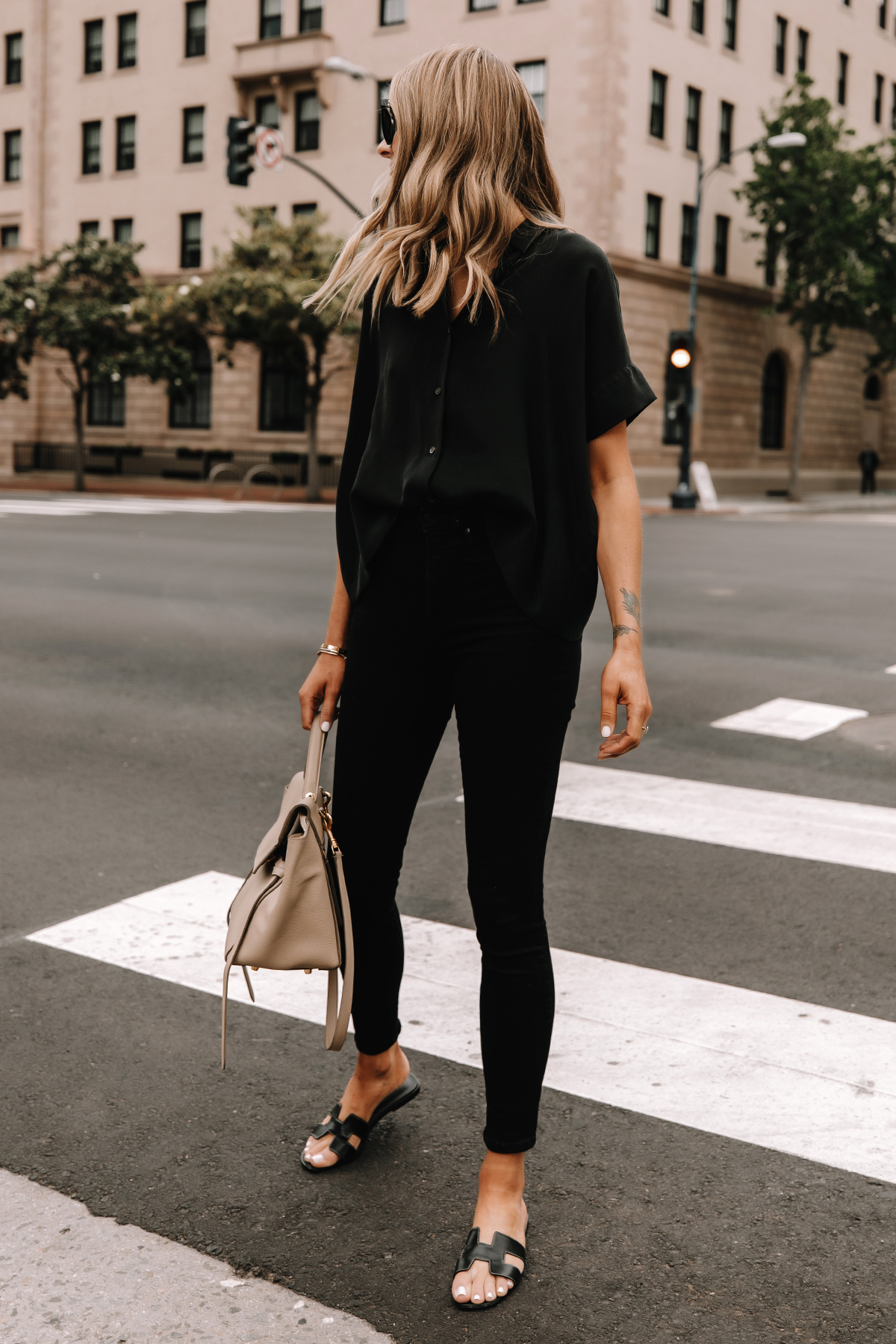 Fashion Jackson Wearing Everlane Black Button Down Shirt Everlane Black Skinny Jeans Hermes Oran Black Sandals Celine Belt Bag Street Style