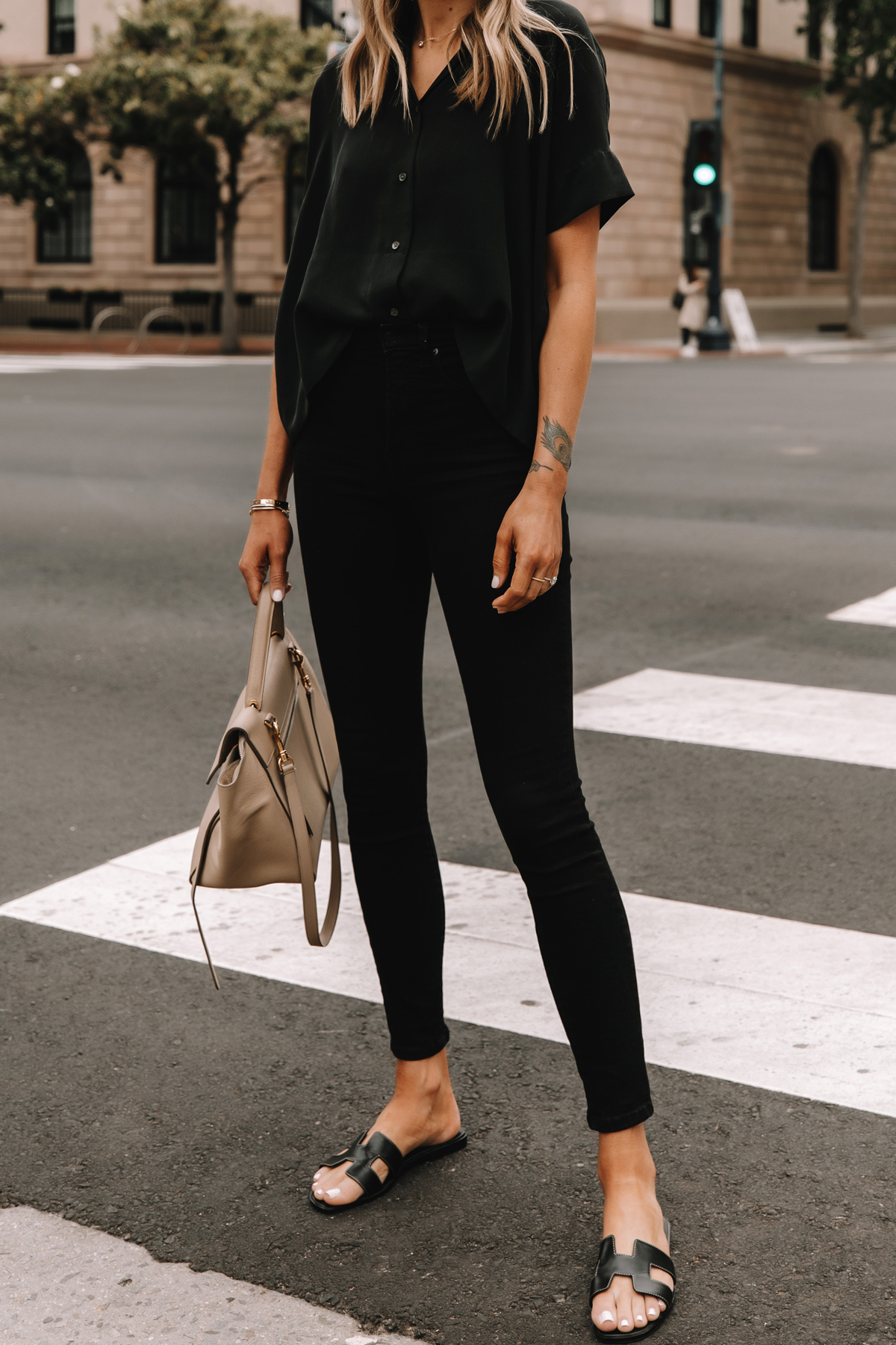 Fashion Jackson Wearing Everlane Black Button Down Shirt Everlane Black Skinny Jeans Hermes Oran Black Sandals Celine Belt Bag