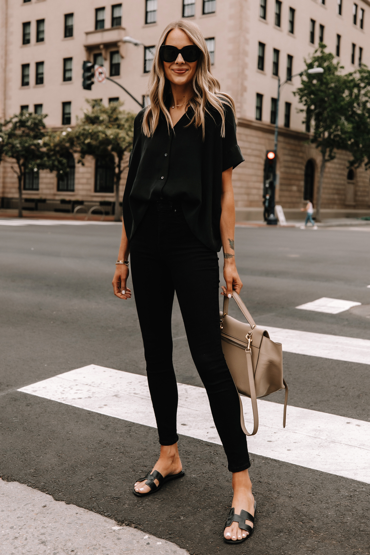 Fashion Jackson Wearing Everlane Black Button Down Shirt Everlane Black Skinny Jeans Hermes Oran Black Sandals Celine Taupe Belt Bag Street Style 2