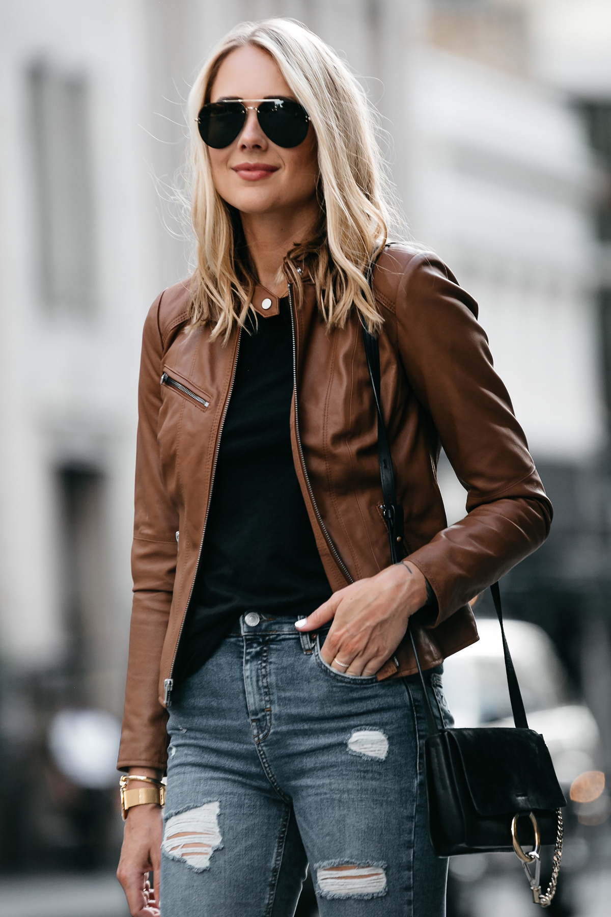 Blonde Woman Wearing Tan Leather Jacket Black Tshirt Denim Ripped Skinny Jeans Outfit Chloe Faye Handbag Fashion Jackson Dallas Blogger Fashion Blogger Street Style