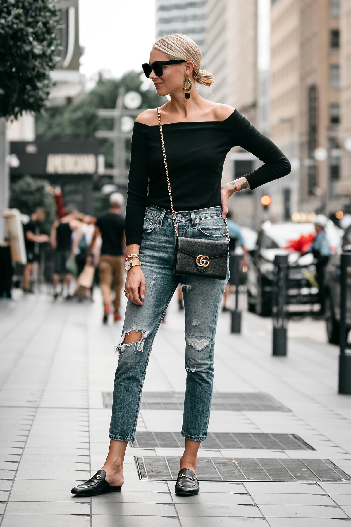 Blonde Woman Wearing Jcrew black off the shoulder top Levis Denim Ripped Jeans Gucci Marmont Handbag Gucci Princetown Loafer Mules Fashion Jackson Dallas Blogger Fashion Blogger Street Style