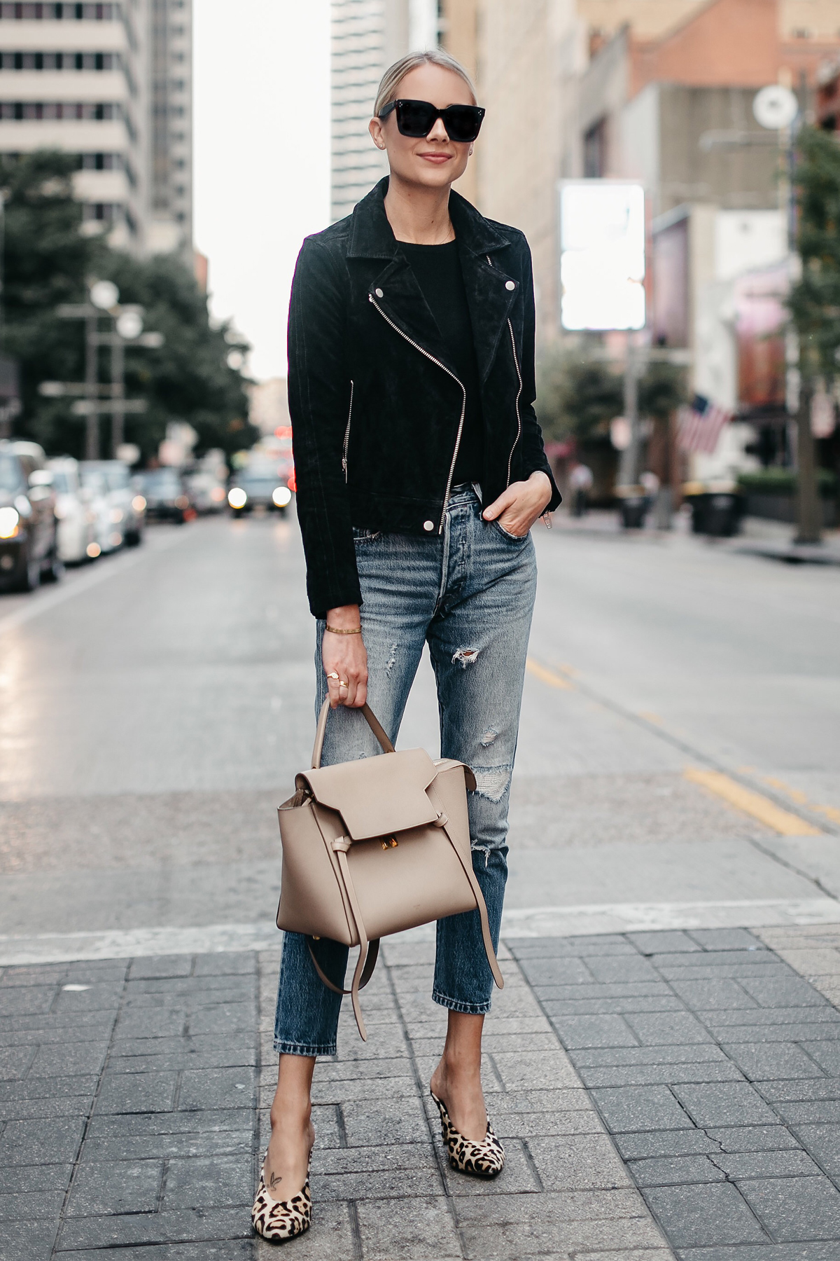 Blonde Woman Wearing Black Suede Moto Jacket Black Sweater Denim Ripped Jeans Celine Mini Belt Bag Leopard Heels Fall-Fashion Must Haves Fashion Jackson Dallas Blogger Fashion Blogger Street Style