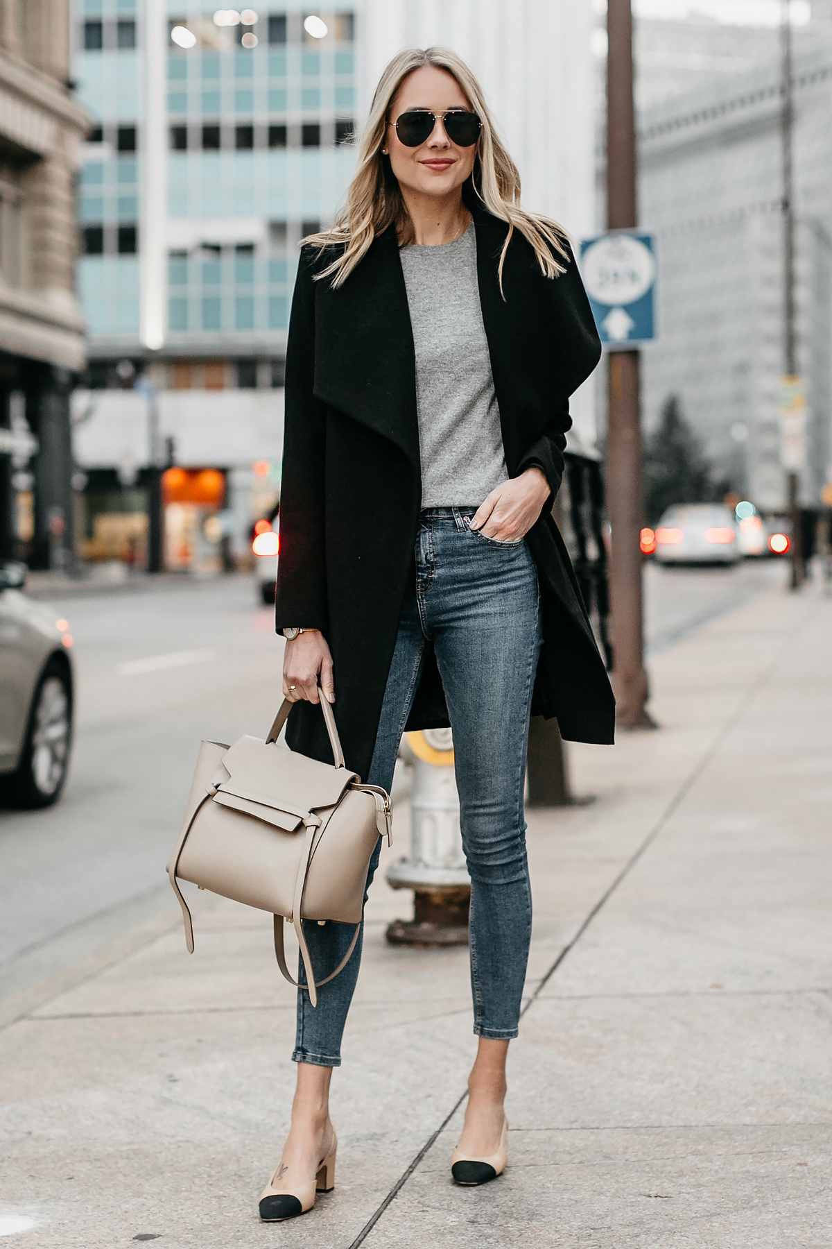Blonde Woman Wearing Black Wrap Coat Grey Sweater Denim Skinny Jeans Chanel Slingbacks Celine MIni Belt Bag Fashion Jackson Dallas Blogger Fashion Blogger Street Style