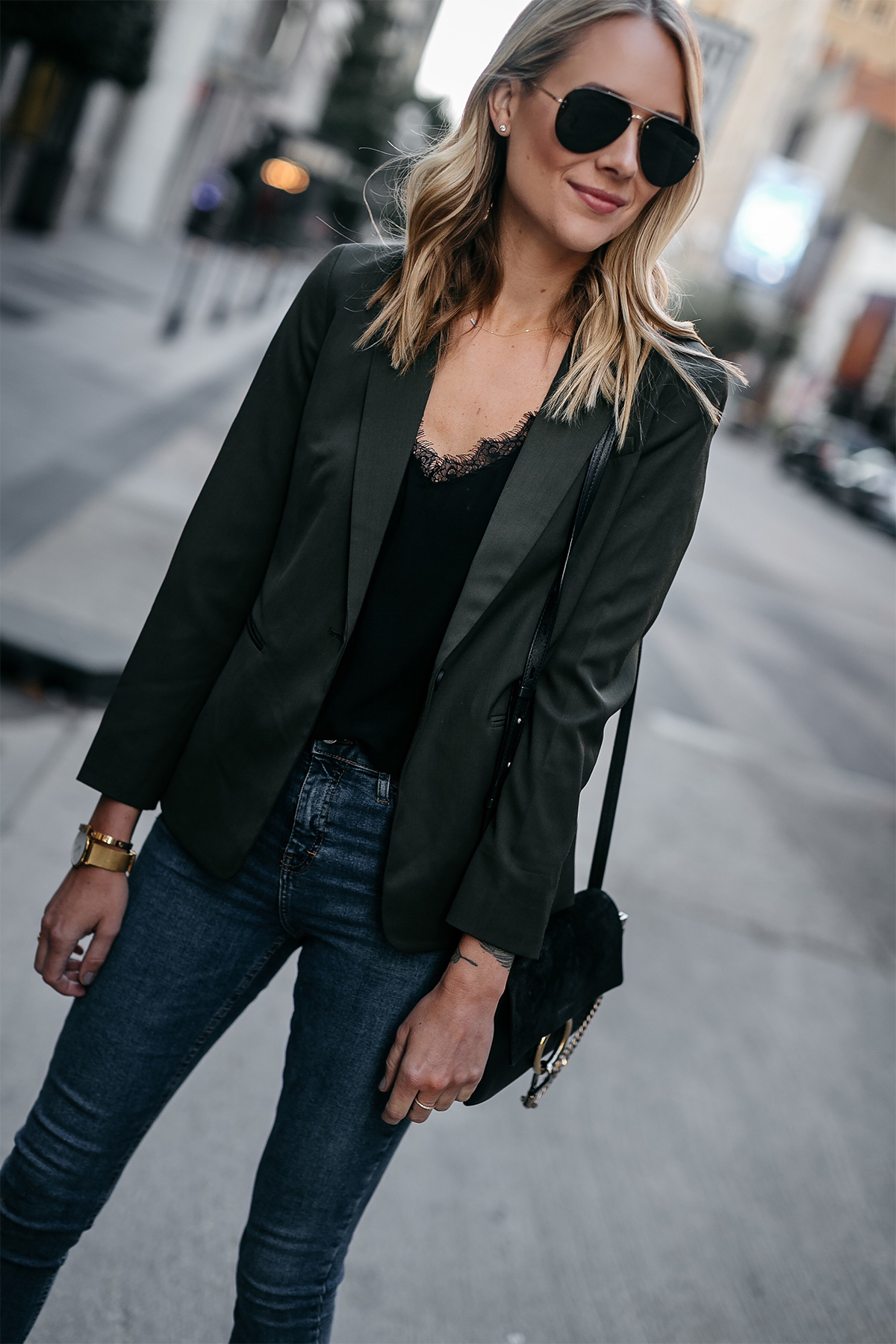 Chic fall outfit idea with long black blazer, lace camisole, black