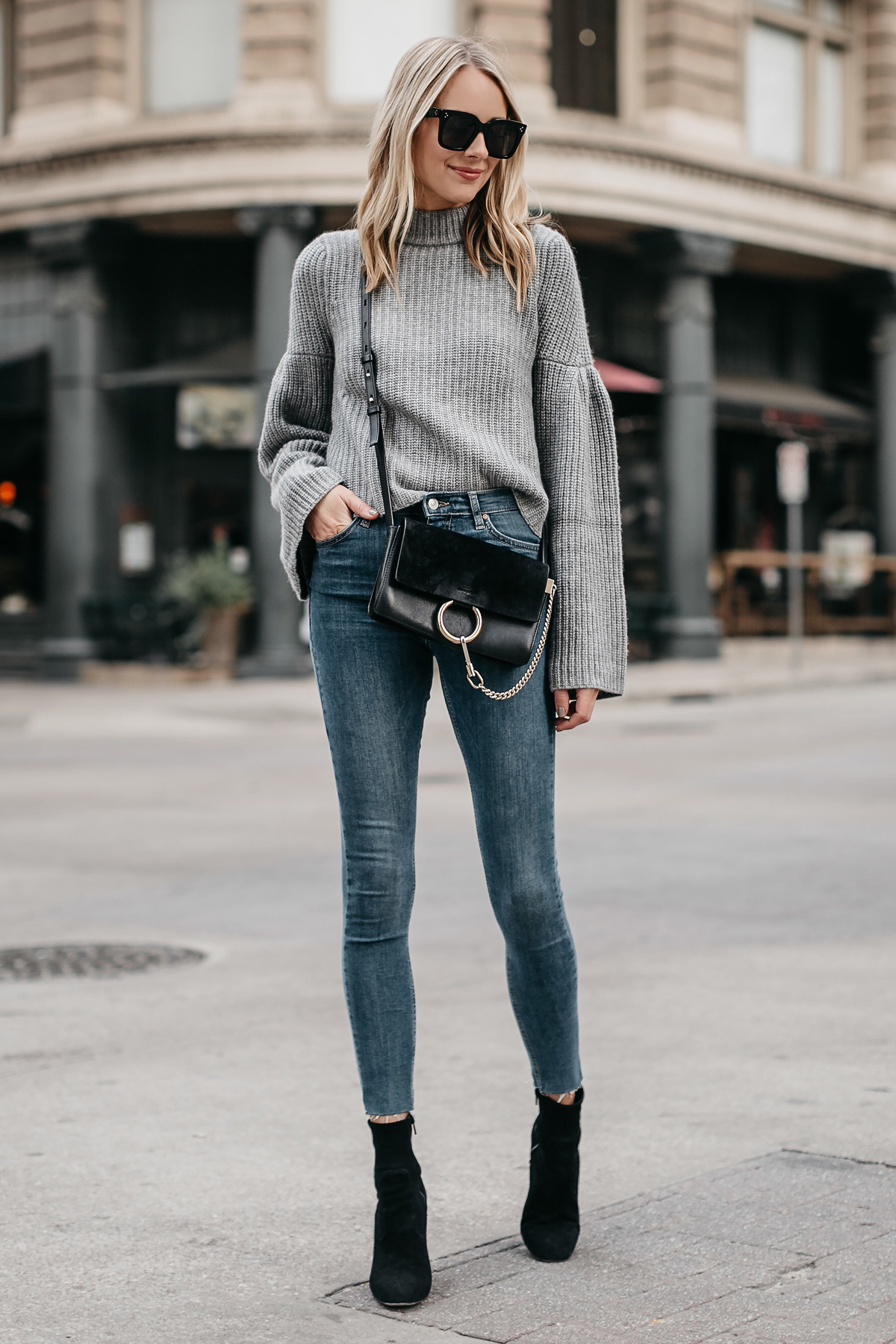 Women's Black Sweatshirt, Black Skinny Pants, Black Leather Ankle Boots,  Black Sunglasses