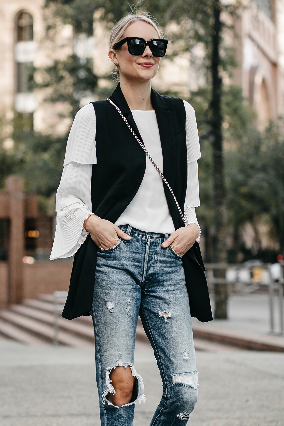 https://fashionjackson.com/wp-content/uploads/2017/10/Fashion-Jackson-Long-Black-Vest-White-Pleat-Sleeve-Top-Denim-Ripped-Jeans-2.jpg