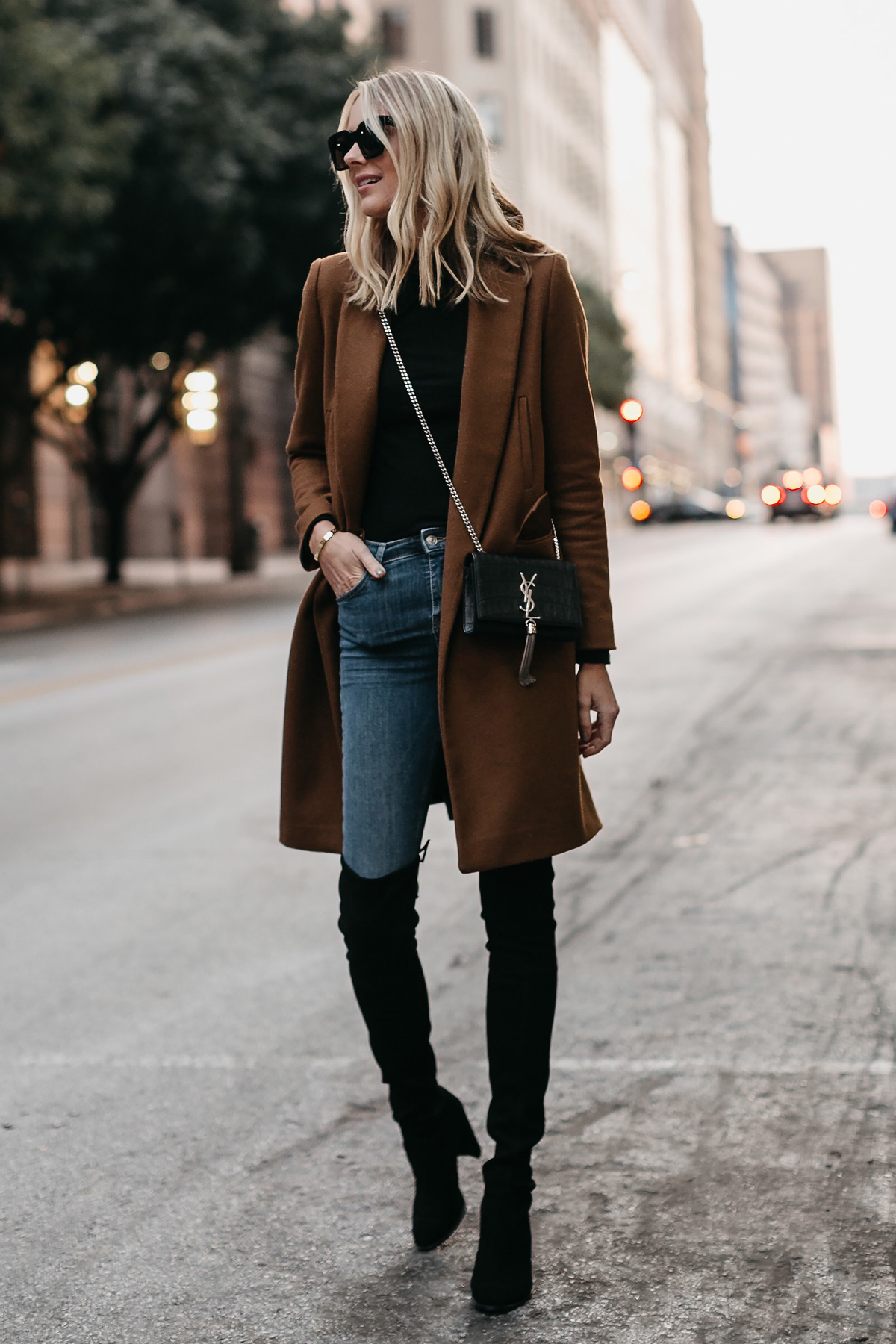 Blonde Woman Wearing Camel Wool Coat Denim Skinny Jeans Black Over the Knee Boots Saint Laurent Crossbody Fashion Jackson Dallas Blogger Fashion Blogger Street Style