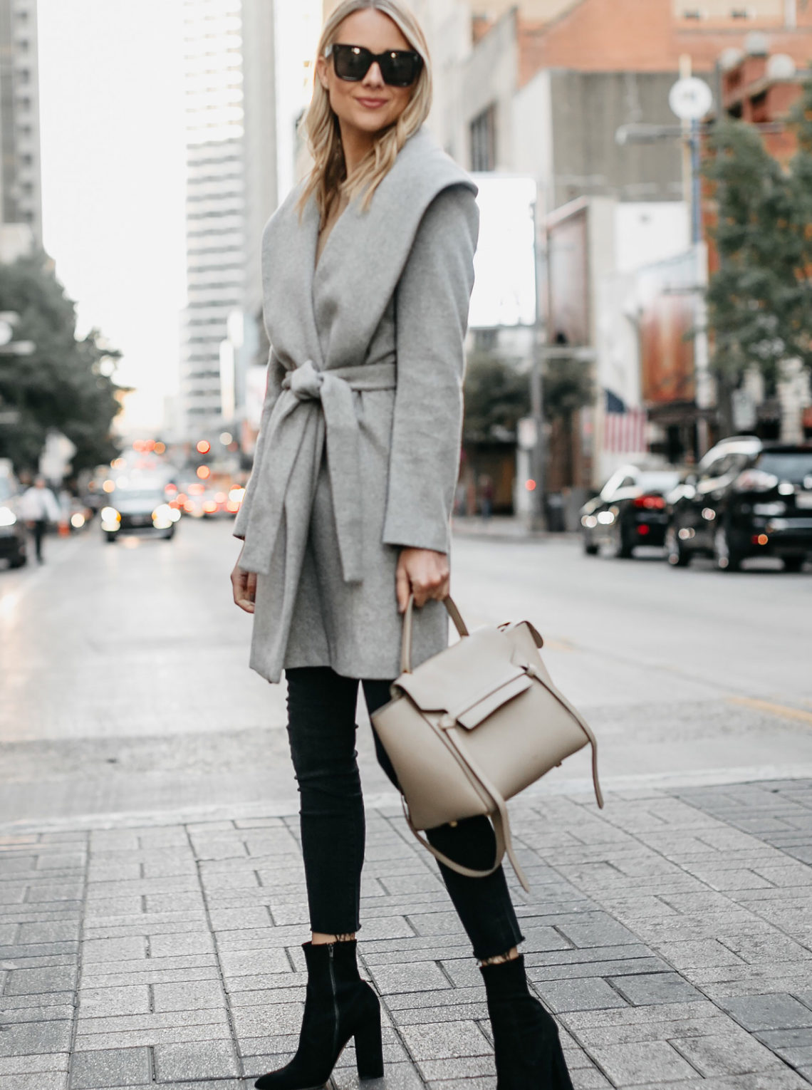 Blonde Woman Wearing Grey Wrap Coat Black Skinny Jeans Black Booties Outfit Celine Mini Belt Bag Fashion Jackson Dallas Blogger Fashion Blogger Street Style