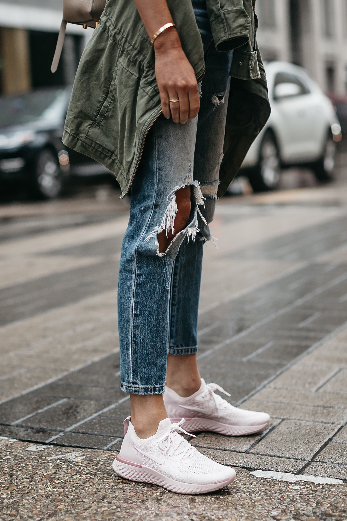 Woman Wearing Nike React Running Shoe Ripped Denim Jeans Green Utility Jacket Fashion Jackson Dallas Blogger Fashion Blogger Street Style