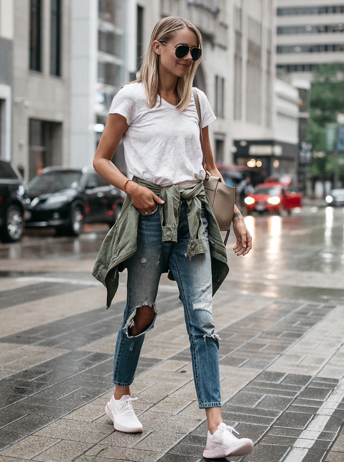 Blonde Woman Wearing Nike React Running Shoe White Tshirt Ripped Denim Jeans Green Utility Jacket Fashion Jackson Dallas Blogger Fashion Blogger Street Style