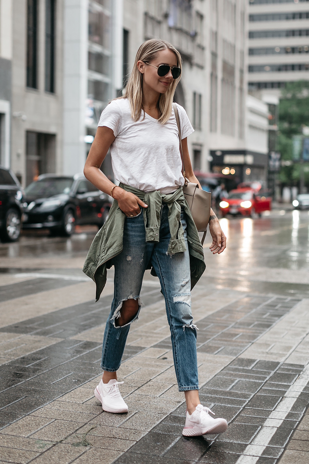 Blonde Woman Wearing Nike React Running Shoe White Tshirt Ripped Denim Jeans Green Utility Jacket Fashion Jackson Dallas Blogger Fashion Blogger Street Style