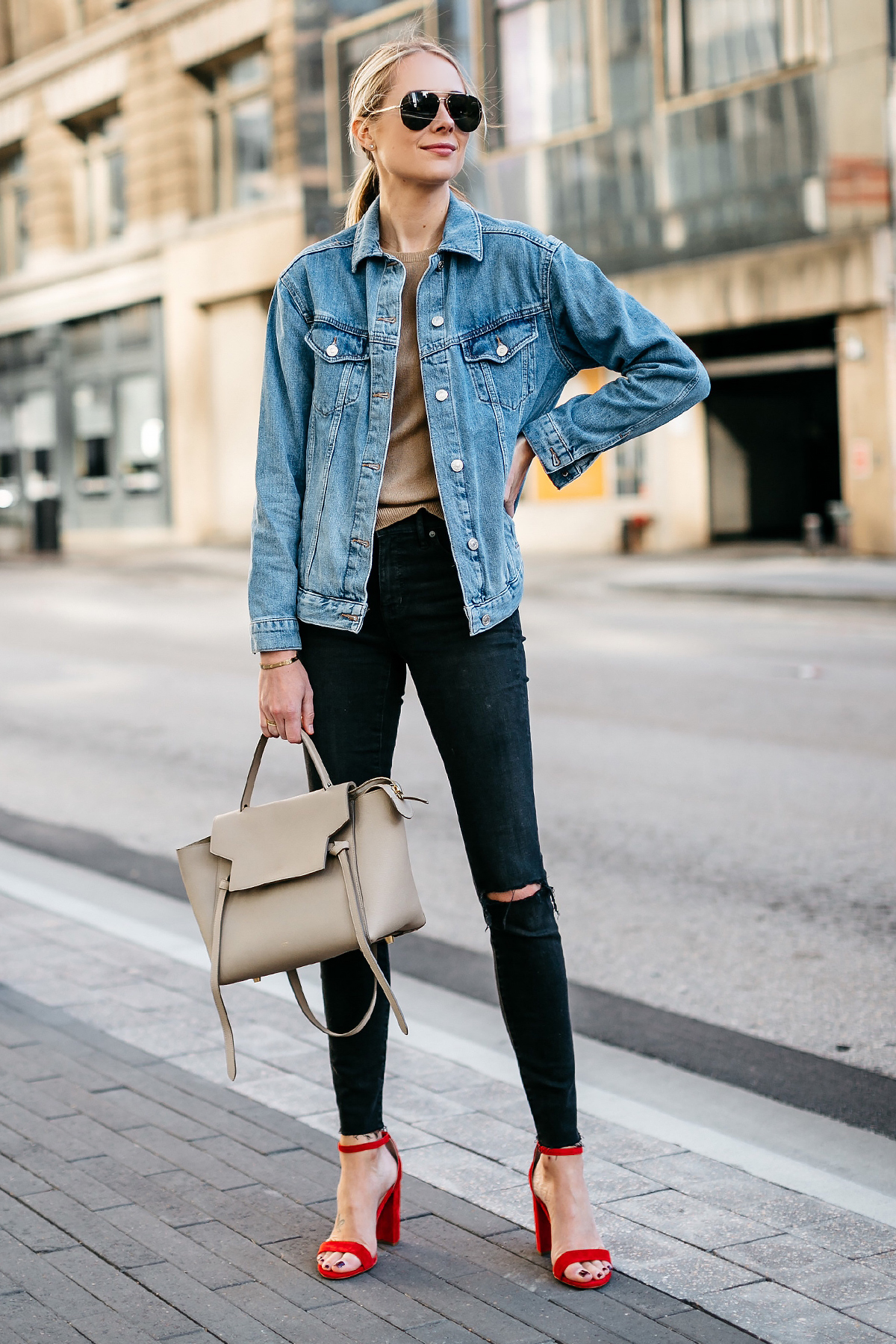 Blonde Woman Wearing Topshop Oversized Denim Jacket Tan Sweater Black Ripped Skinny Jeans Celine Mini Belt Bag Celine Aviator Sunglasses Red Ankle Strap Heeled Sandals Fashion Jackson Dallas Blogger Fashion Blogger Street Style