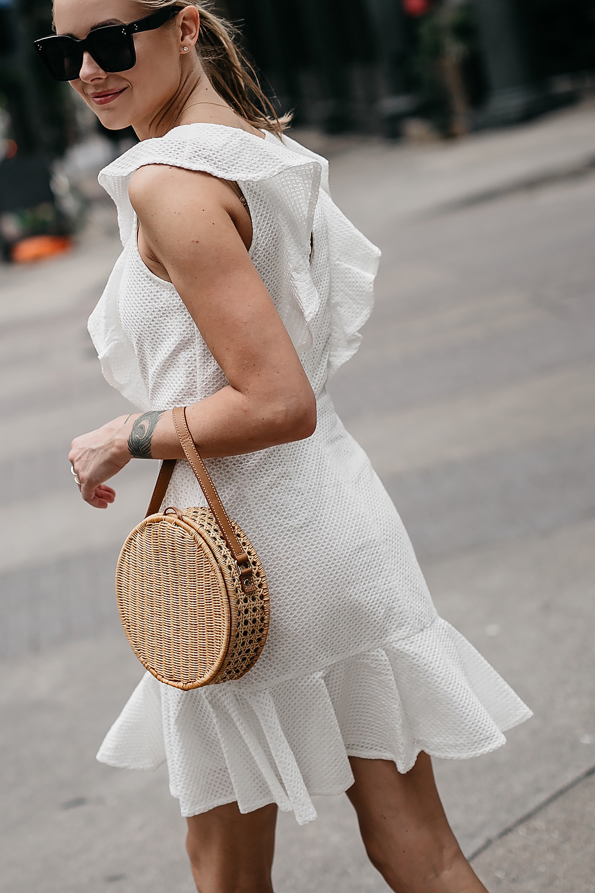 Blonde Woman Wearing Bloomingdales White Eyelet Ruffle Dress Circle Straw Handbag Fashion Jackson Dallas Blogger Fashion Blogger Street Style