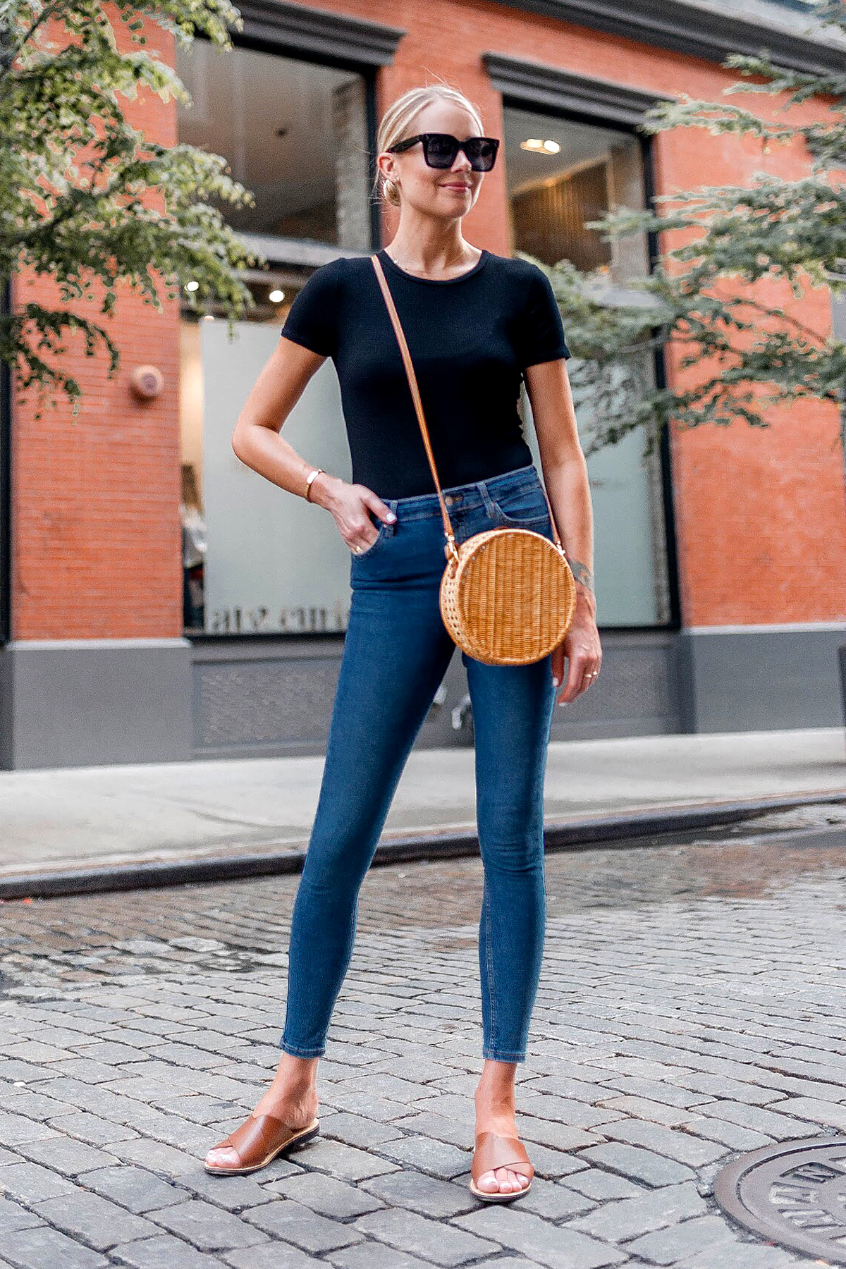 black bodysuit and blue jeans