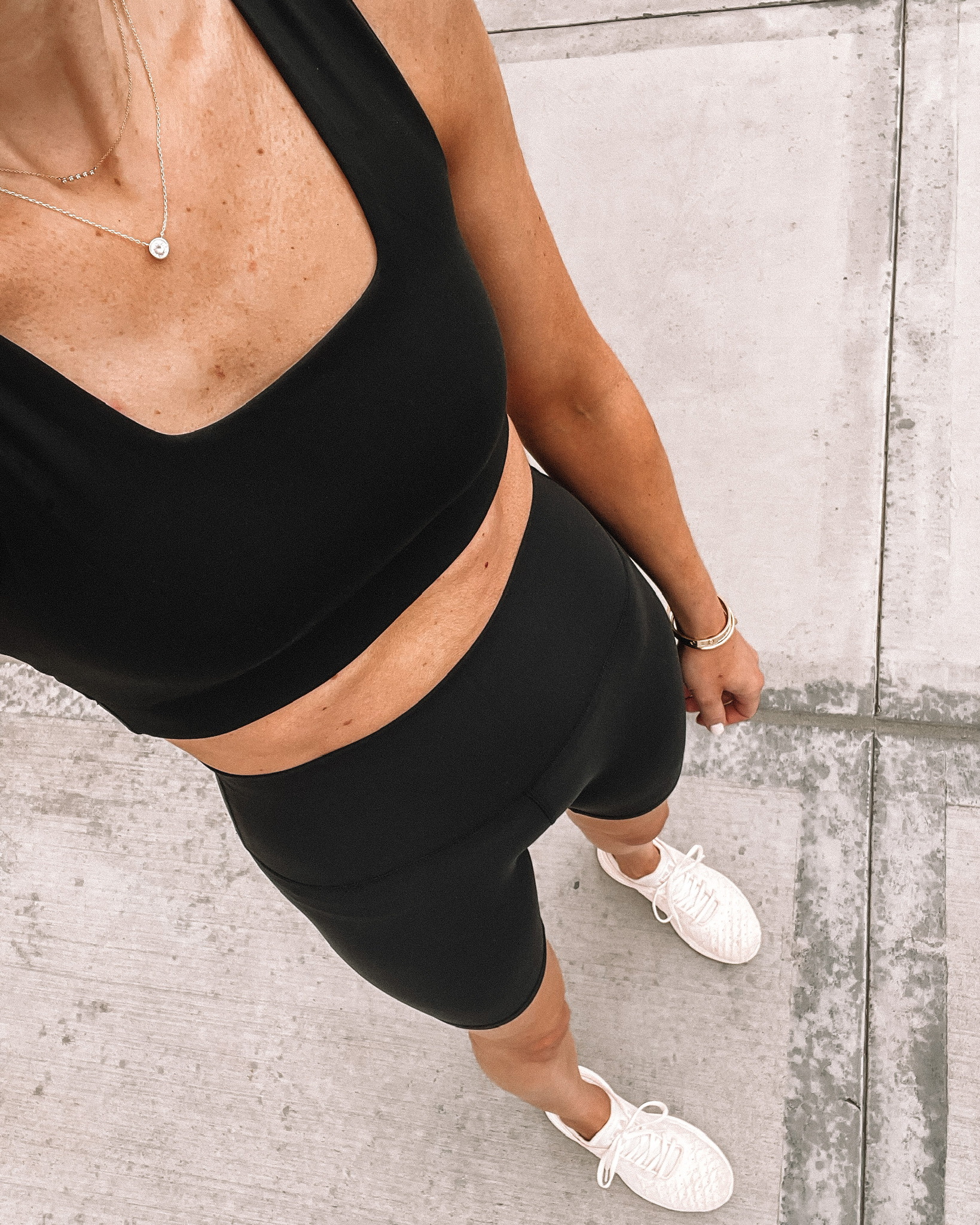 Fashion Jackson Wearing Varley Black Sports Bra lululemon Black Align Biker Shorts APL Sneakers workout outfits for women