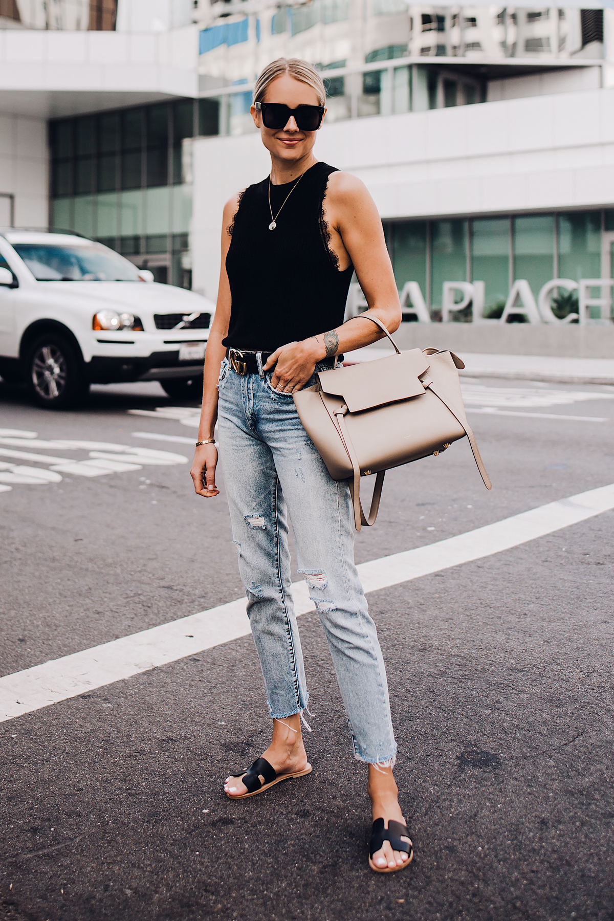 Blonde Woman Wearing Black Sweater Tank Lace Bralette Gucci Logo Belt Ripped Denim Jeans Black Steven Greece Sandals Celine Mini Belt Bag Fashion Jackson San Diego Fashion Blogger Street Style