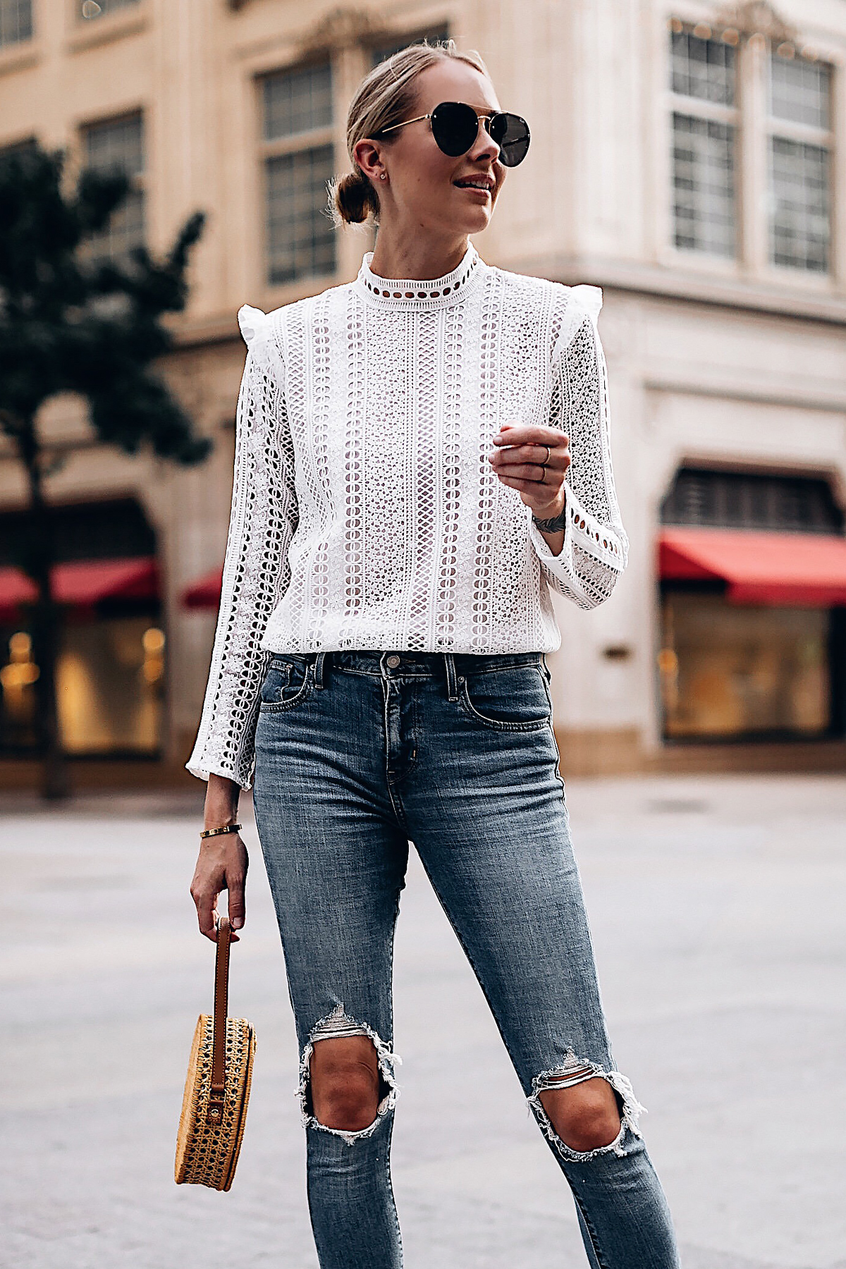 Blonde Woman Wearing Fashion Jackson Bloomingdales AQUA White Lace Ruffle Top Levis 721 Skinny Jeans Serpui Straw Circle Handbag Quay Aviator Sunglasses Fashion Jackson San Diego Fashion Blogger Street Style