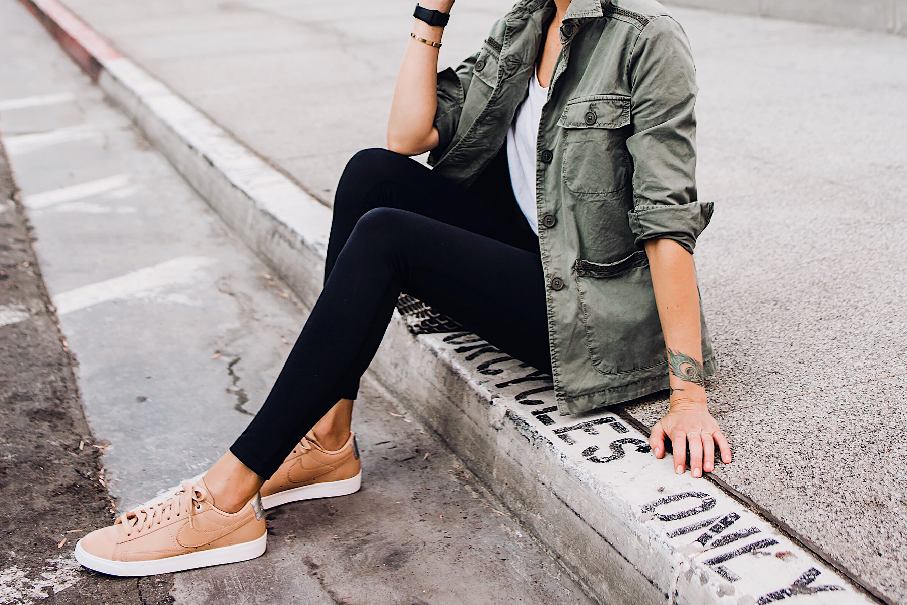 Woman Wearing Fashion Jackson Nordstrom Green Utility Jacket White Tshirt Black Leggings Nike Sneakers Beige Fashion Jackson San Diego Fashion Blogger Street Style