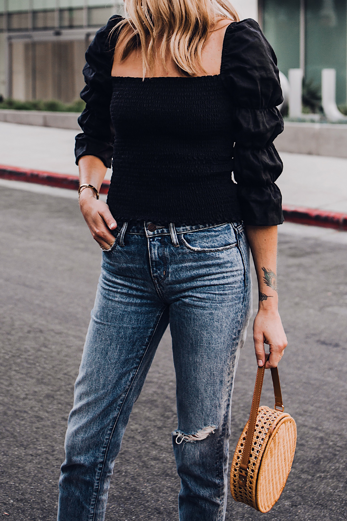 Blonde Woman Wearing Fashion Jackson Reformation Gala Top Black Ripped Jeans Cane Circle Straw Handbag Fashion Jackson San Diego Fashion Blogger Street Style