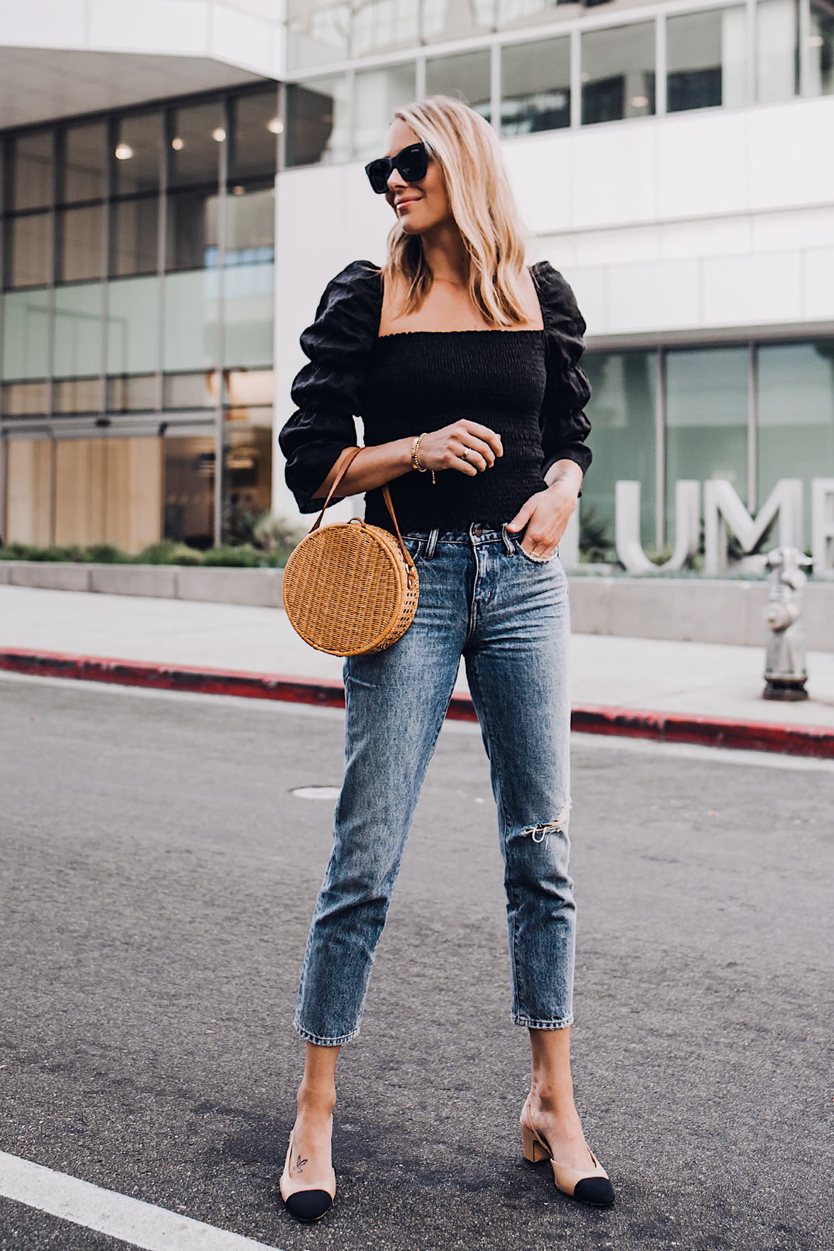 Blonde Woman Wearing Fashion Jackson Reformation Gala Top Black Straight Leg Ripped Jeans Chanel Slingback Shoes Cane Circle Straw Handbag Black Sunglasses Fashion Jackson San Diego Fashion Blogger Street Style