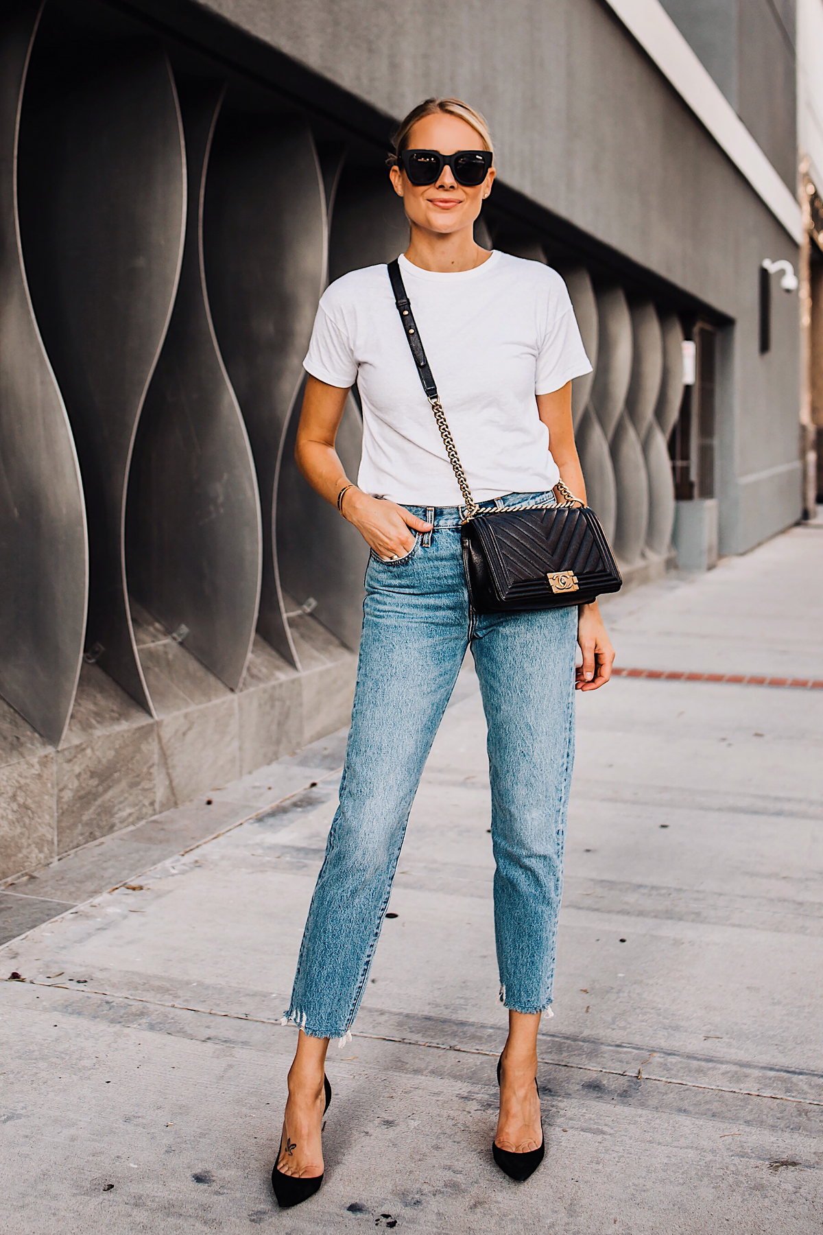 Blonde Woman Wearing Fashion Jackson White Tshirt Levis Wedgie Jeans Chanel Black Boy Bag Christian Louboutin Black Pumps Fashion Jackson San Diego Fashion Blogger Street Style