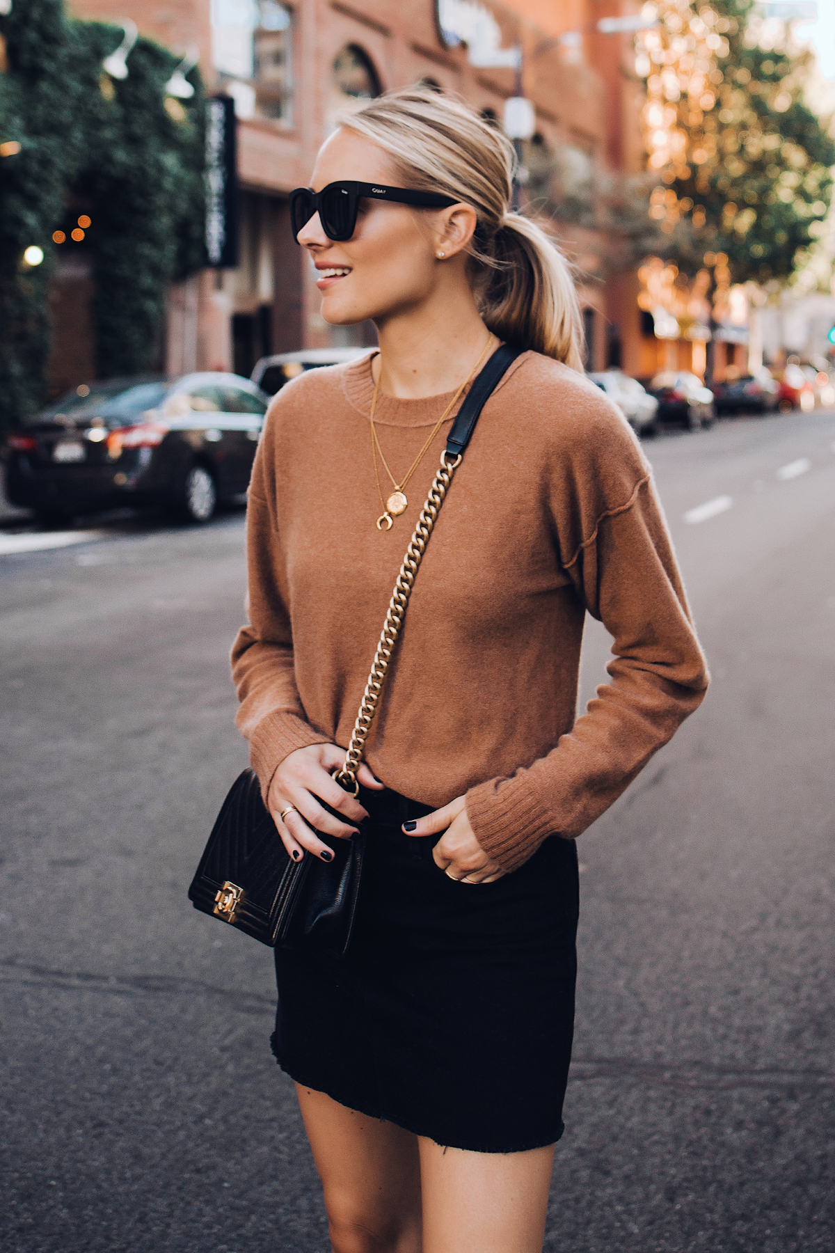 Blonde Woman Wearing Free People Tan Sweater Black Denim Skirt Outfit Chanel Black Boy Bag Fashion Jackson San Diego Fashion Blogger Street Style