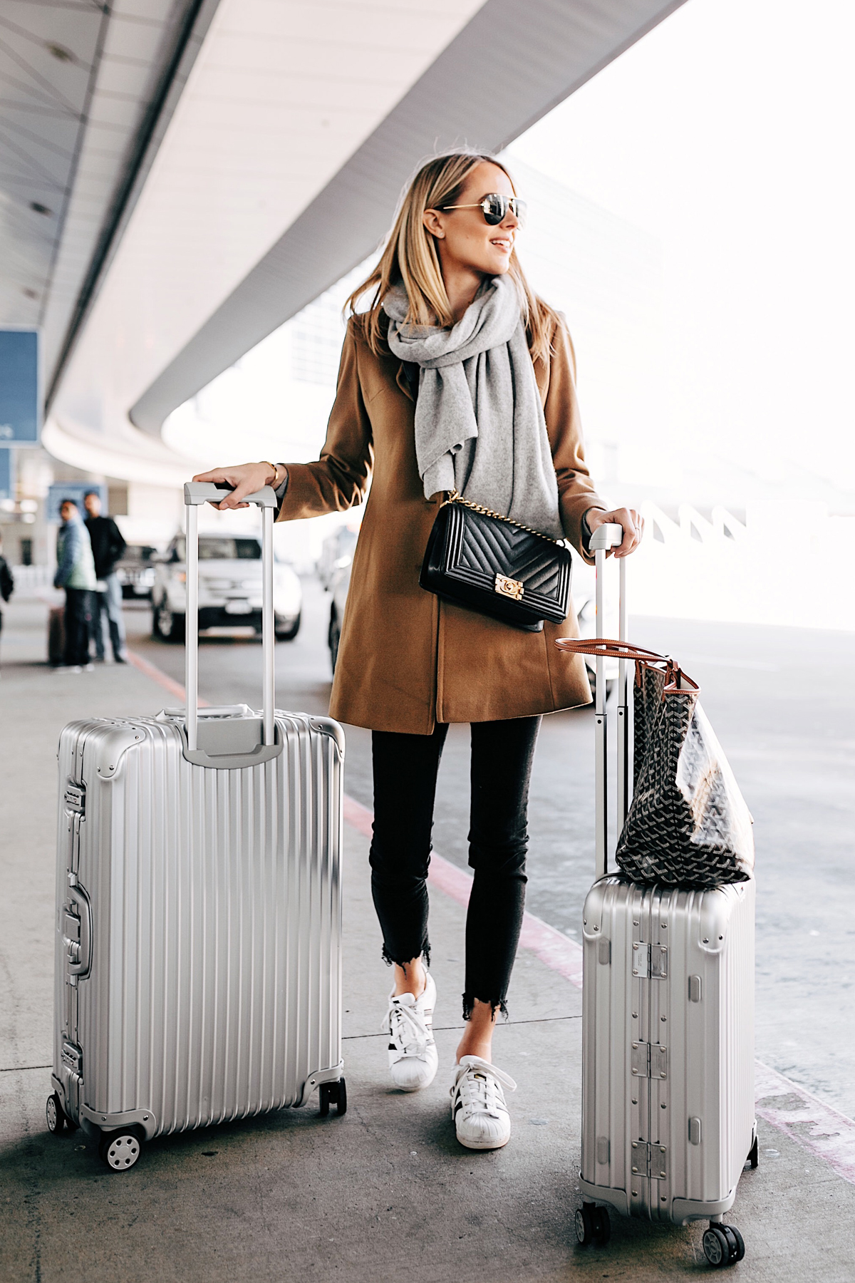 Blonde Woman with Rimowa Luggage at Airport Fashion Jackson