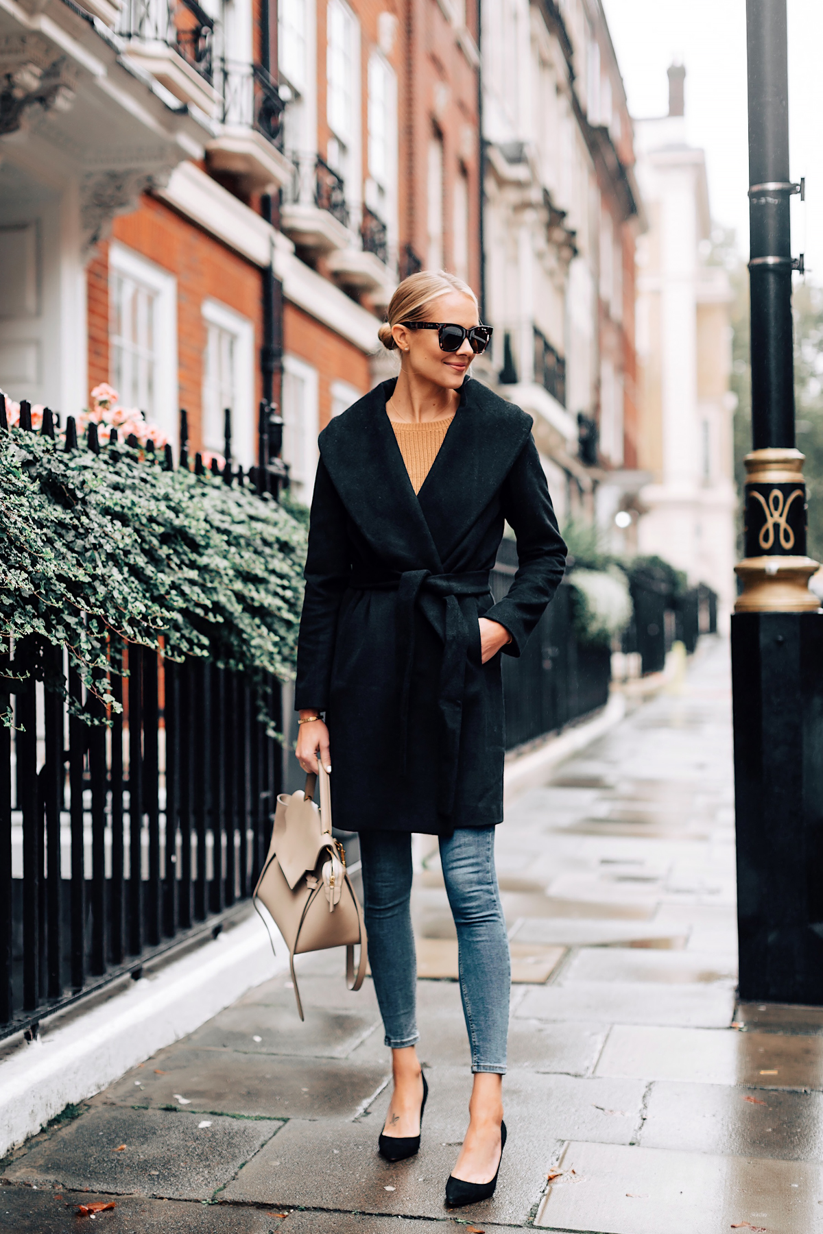 Blonde Woman Wearing Ann Taylor Black Wrap Coat Camel Sweater Denim Skinny Jeans Outfit Black Pumps Fashion Jackson San Diego Fashion Blogger London Street Style