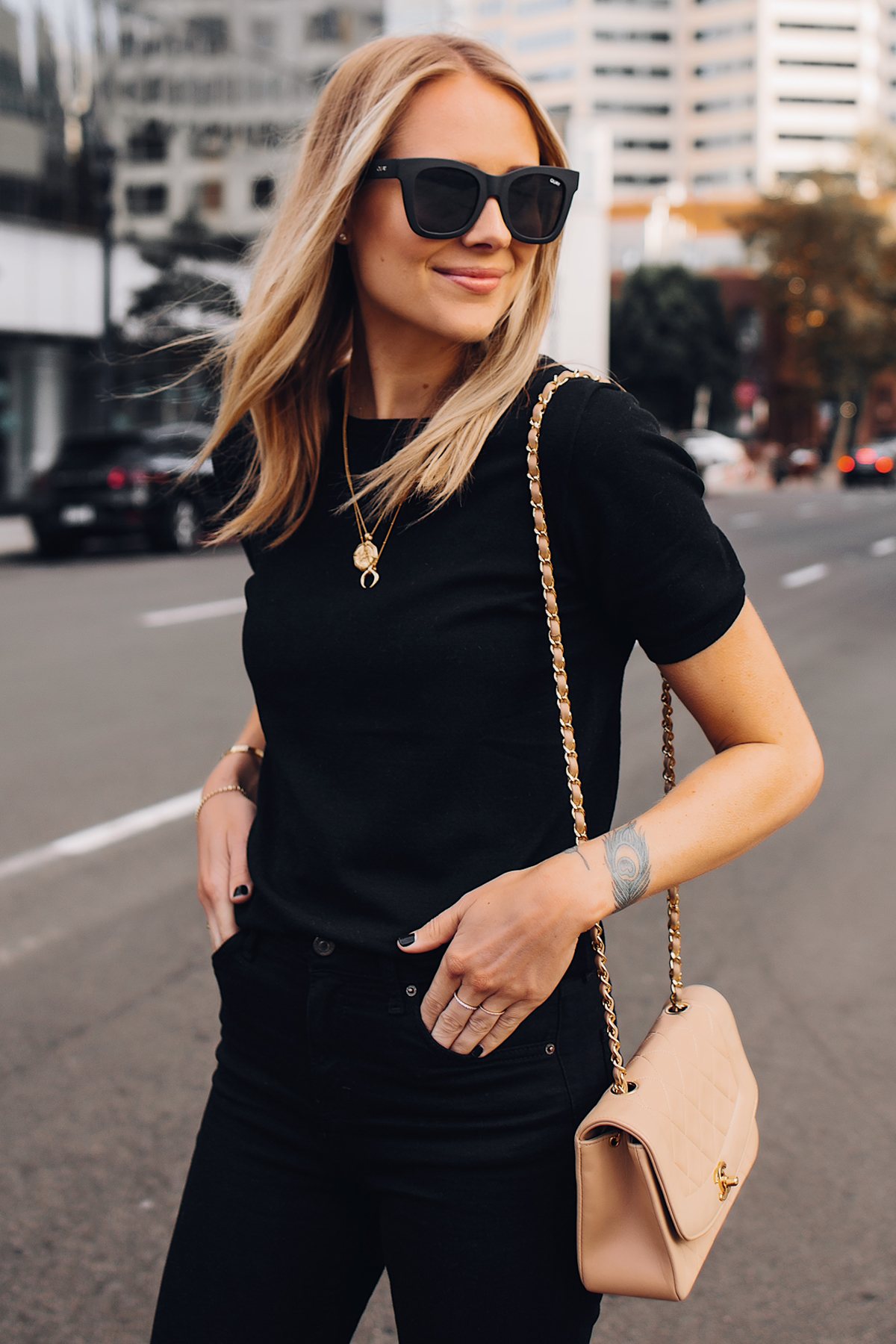Blonde Woman Wearing Black Short Sleeve Top Black Ripped Skinny Jeans Chanel Diana Tan Handbag Gold Missoma Necklaces Fashion Jackson San Diego Fashion Blogger Street Style