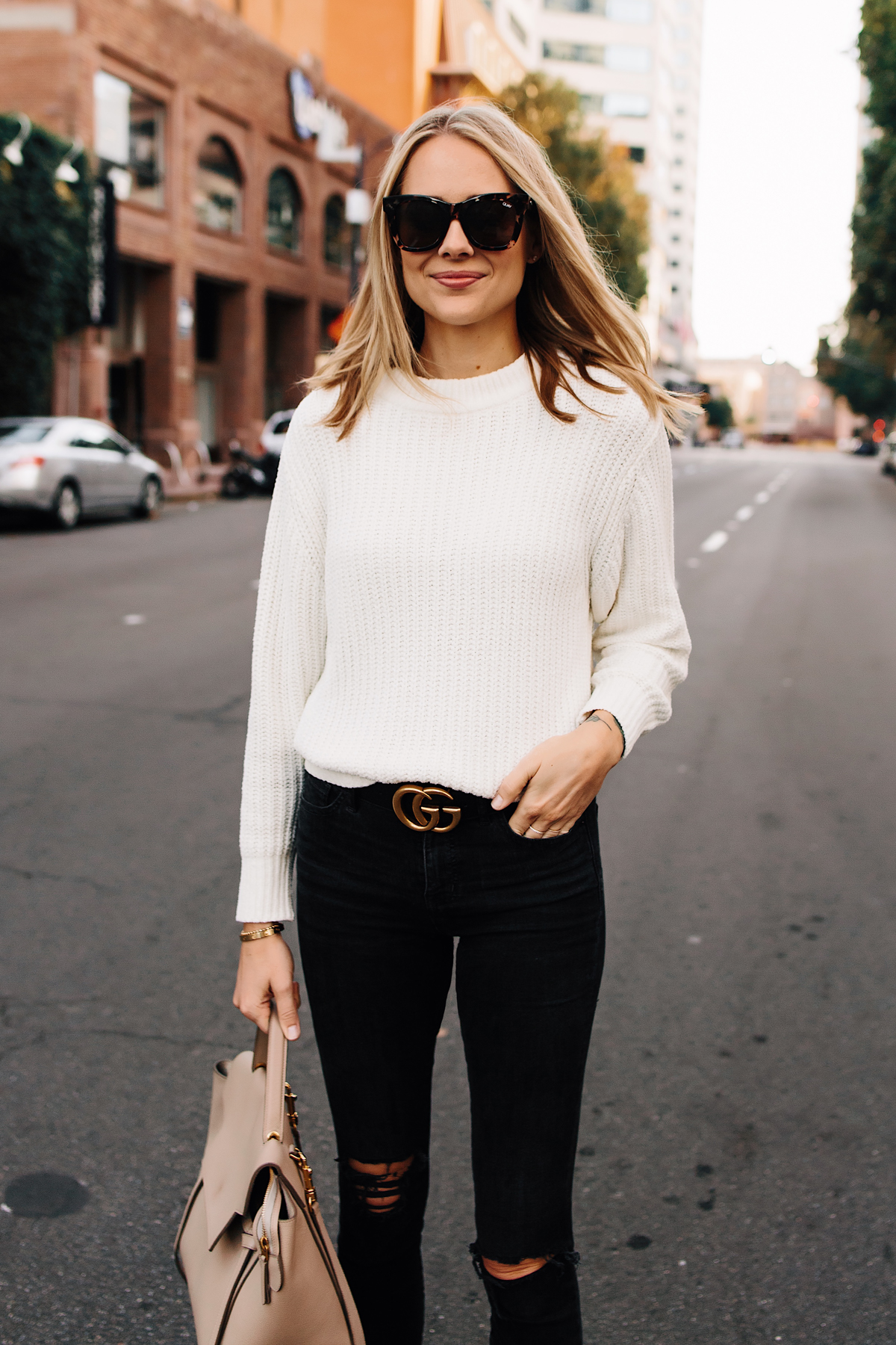 Blonde Woman Wearing Ivory Knit Sweater Black Ripped Jeans Gucci Logo Belt Fashion Jackson San Diego Fashion Blogger Street Style