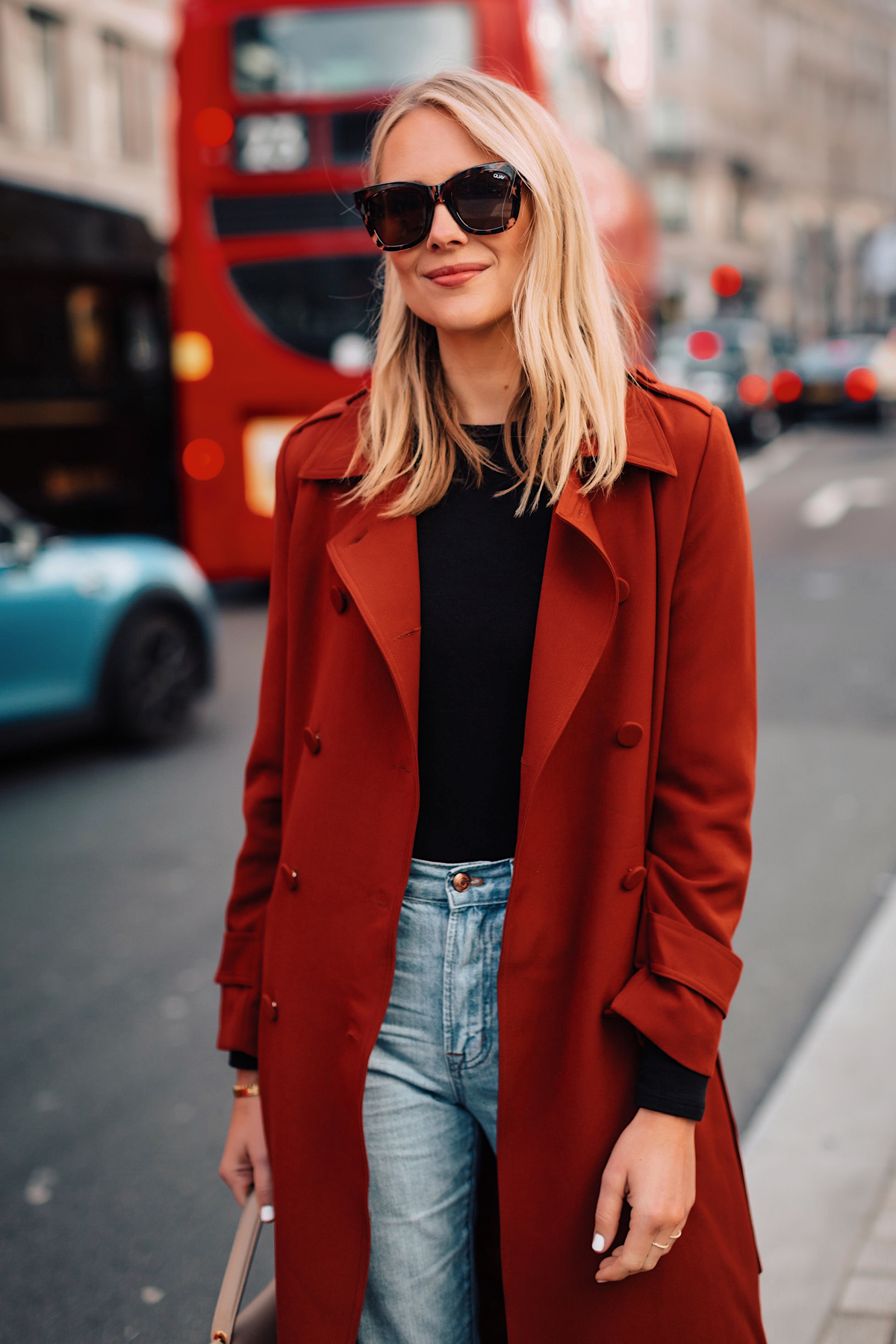 Blonde Woman Wearing Red Trench Coat Black Top Jeans Outfit Fashion Jackson San Diego Fashion Blogger London Street Style
