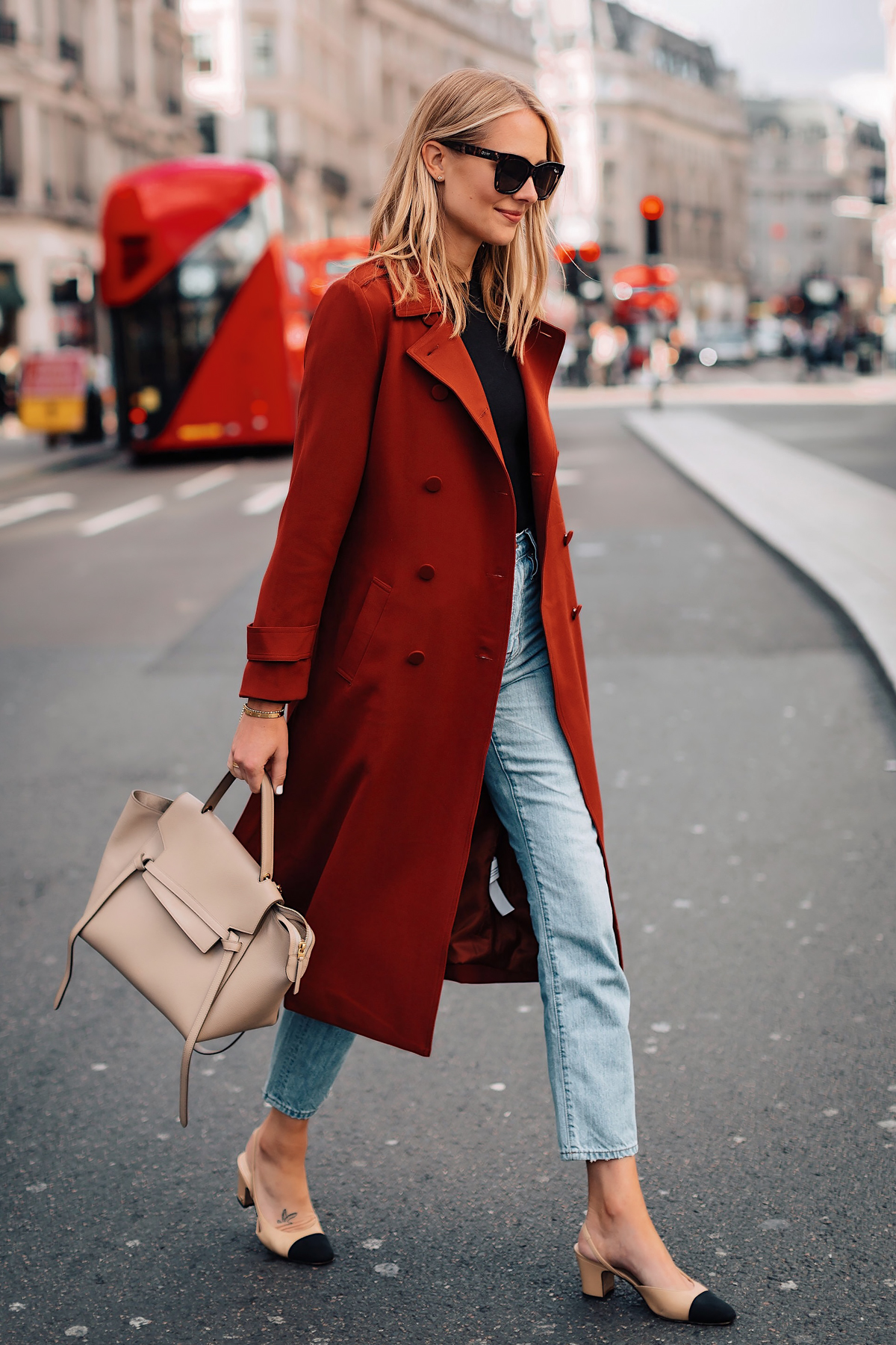 Blonde Woman Wearing Red Trench Coat Black Top Relaxed Jeans Outfit Chanel Slingbacks Celine Mini Belt Bag Fashion Jackson San Diego Fashion Blogger London Street Style