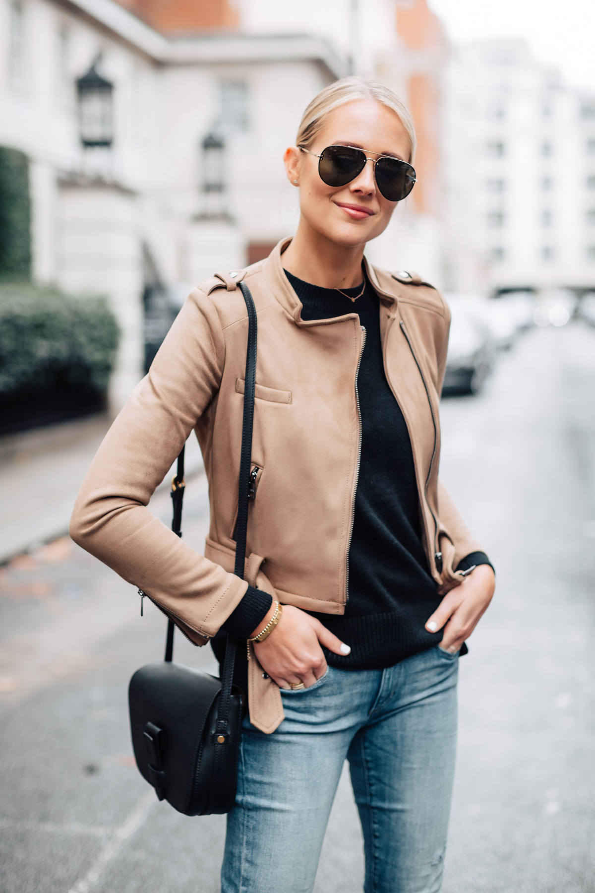 Blonde Woman Wearing Tan Suede Moto Jacket Black Sweater Denim Skinny Jeans Black Handbag Fashion Jackson San Diego Fashion Blogger London Street Style