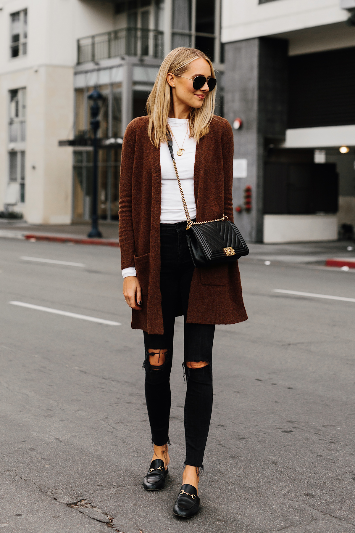 Blonde Woman Wearing Madewell Brown Long Cardigan White Top Madewell Black Ripped Skinny Jeans Gucci Black Princetown Loafer Mules Chanel Black Boy Bag Fashion Jackson San Diego Fashion Blogger Street Style