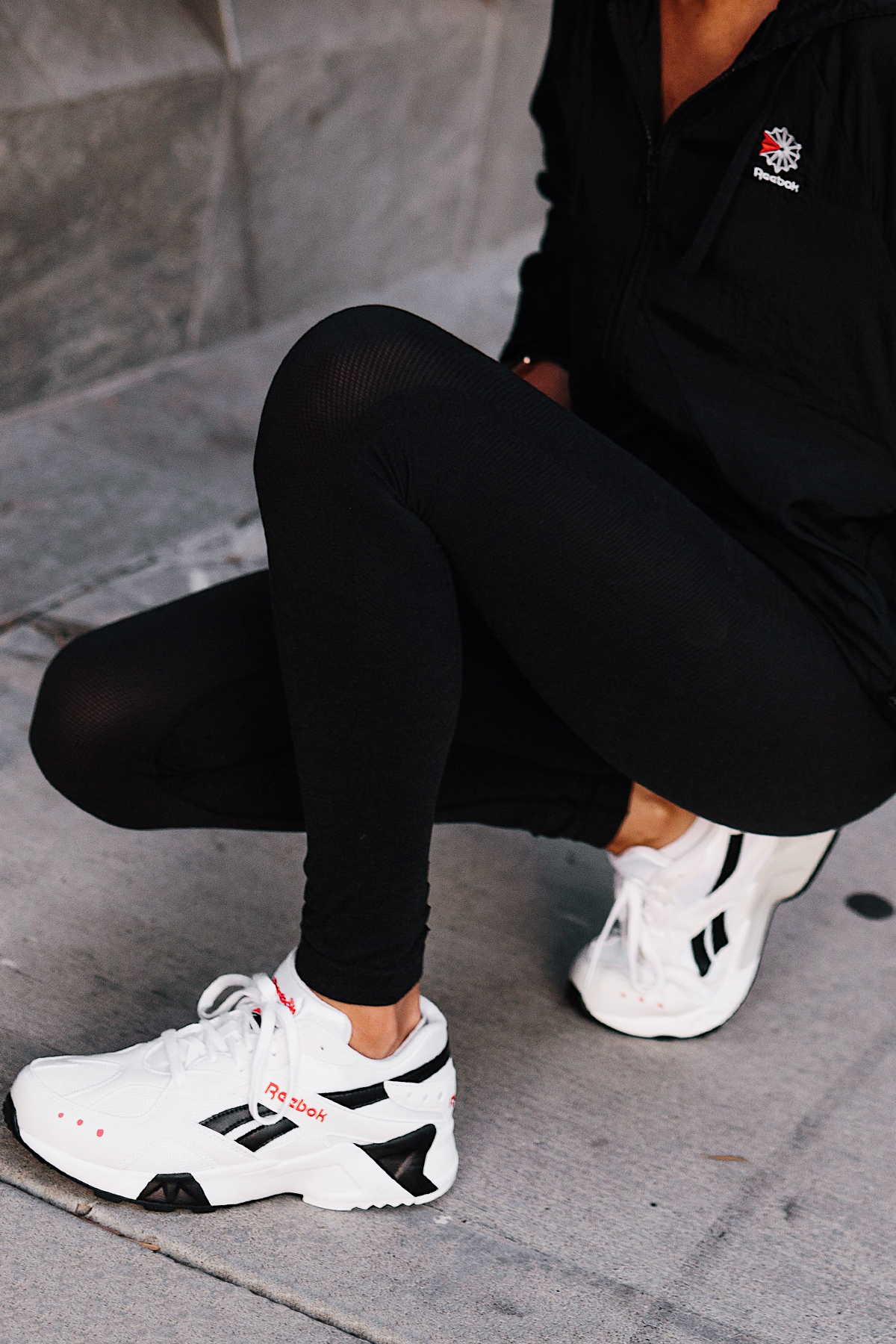 Woman Wearing Reebok Black Windbreaker Reebok Black Leggings Reebok White Aztrek Sneakers Fashion Jackson San Diego Fashion Blogger Activewear Street Style